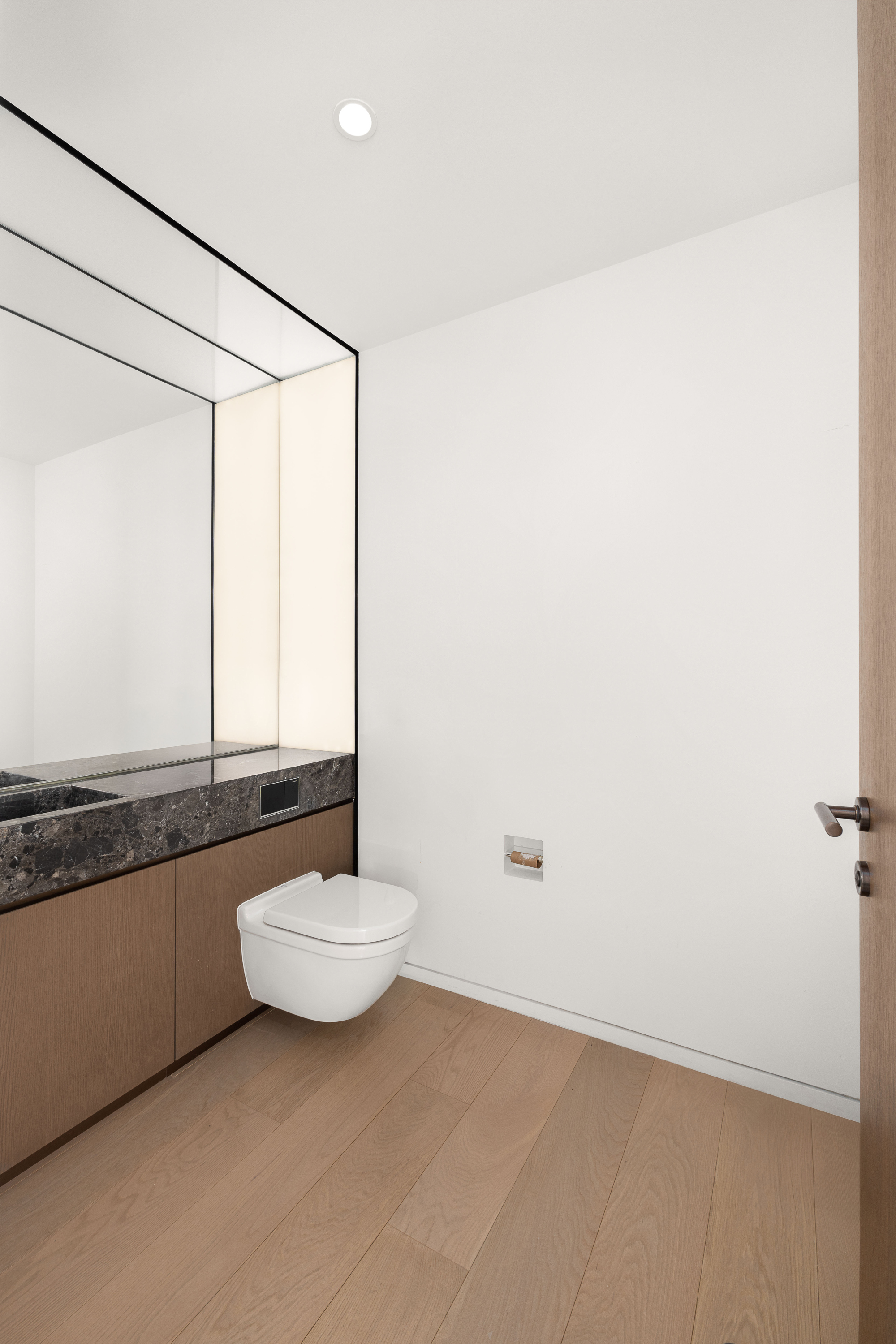 100 East 53rd Street, Unit 40A Manhattan, NY 10022 - Photo 9 of 20 a bathroom with a granite countertop sink and a mirror