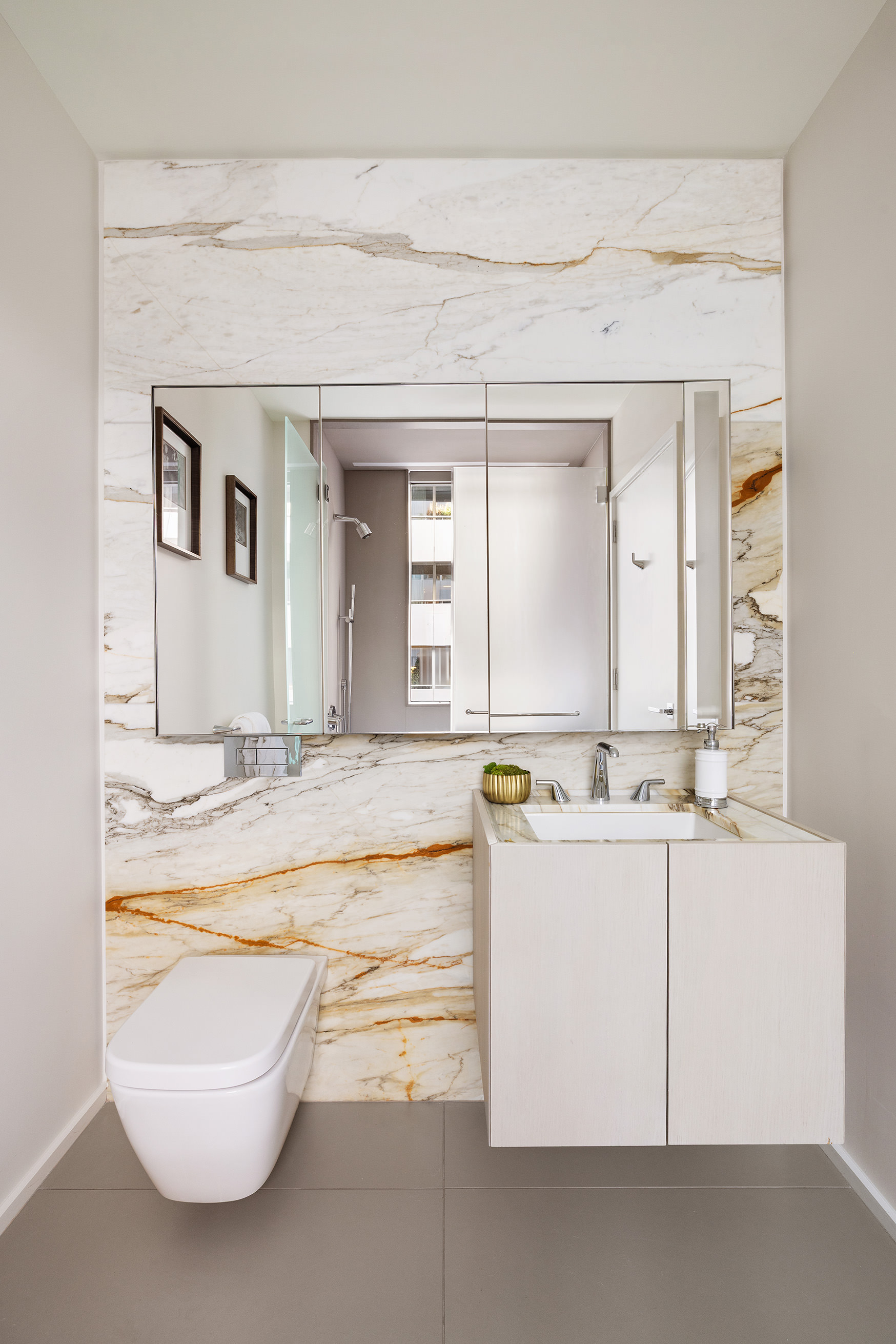 121 East 22nd Street, Unit S603 Manhattan, NY 10010 - Photo 9 of 12 a bathroom with a sink and a mirror