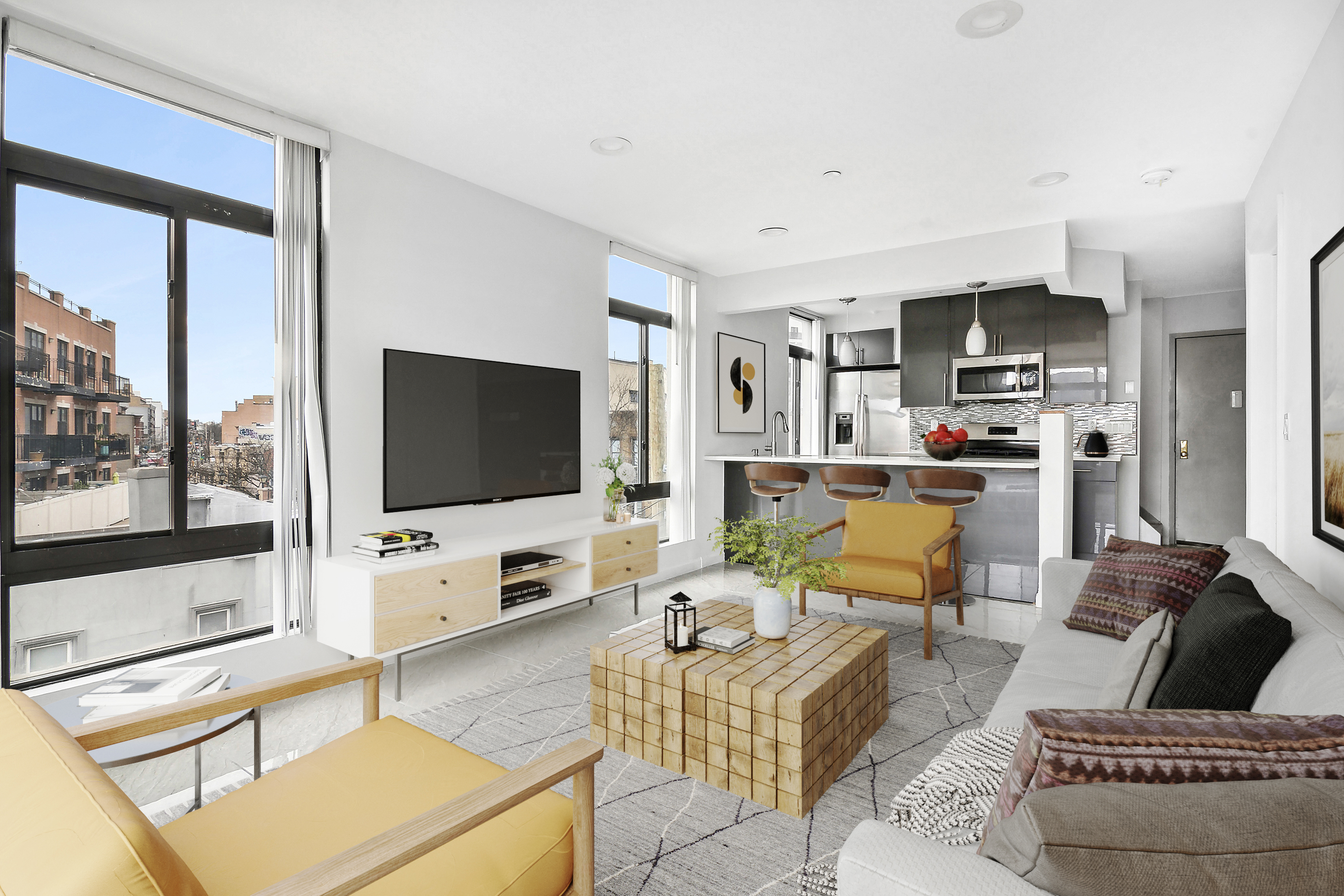 27-16 18th Street, Unit 3 Queens, NY 11102 - Photo 2 of 6 a living room with furniture and a flat screen tv