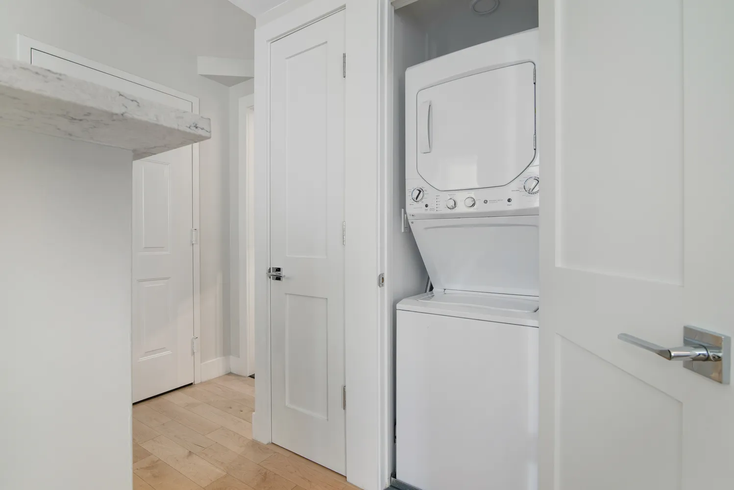 a view of bathroom with washer and dryer