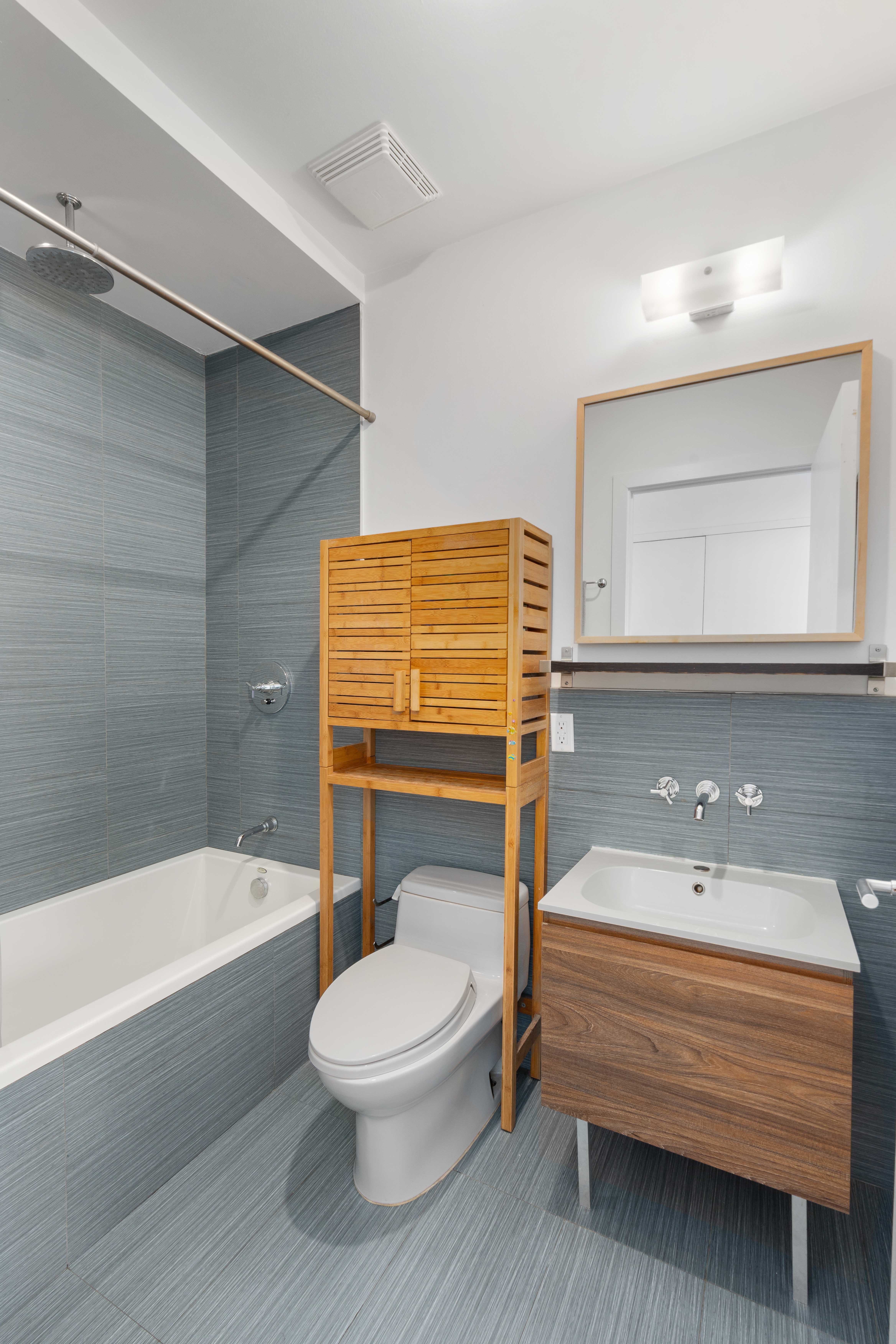 36 Eckford Street, Unit 6B Brooklyn, NY 11222 - Photo 7 of 8 a bathroom with a sink a toilet and bathtub