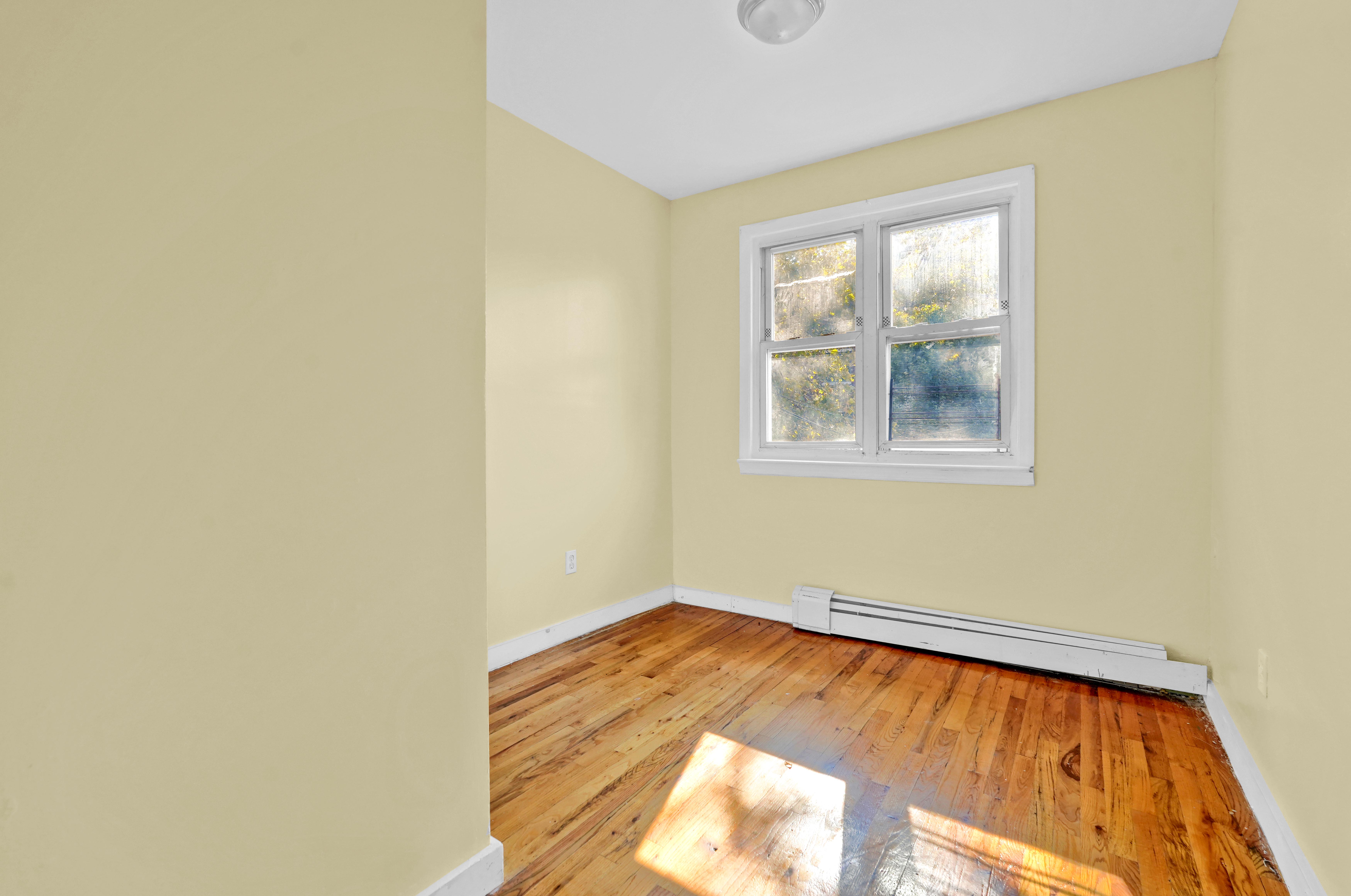 659 Jerome Street Brooklyn, NY 11207 - Photo 10 of 39 an empty room with windows