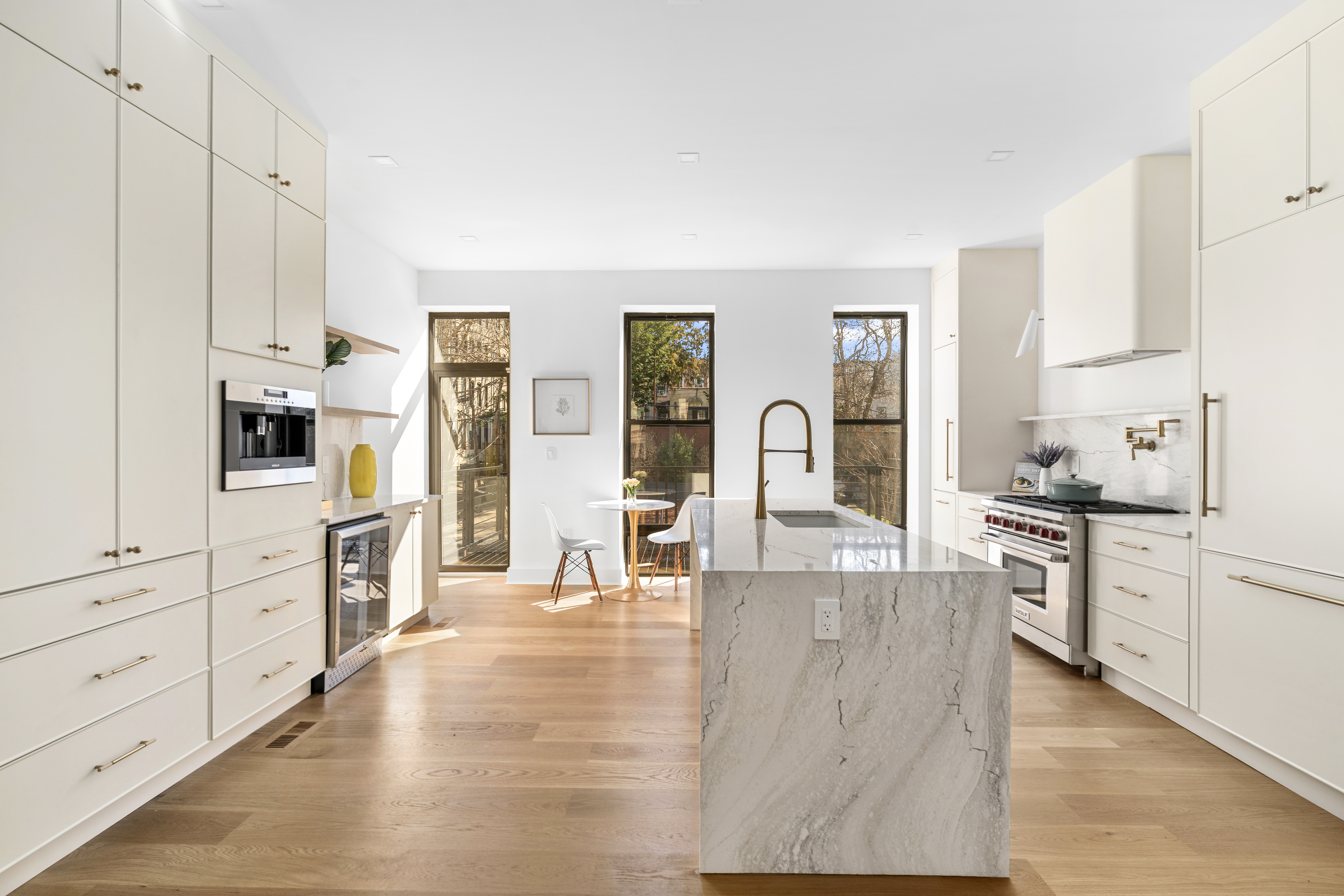718 Sterling Place Brooklyn, NY 11216 - Photo 6 of 15 a large kitchen with cabinets and wooden floor
