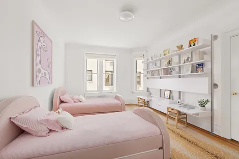 a bedroom with a bed and a cabinets