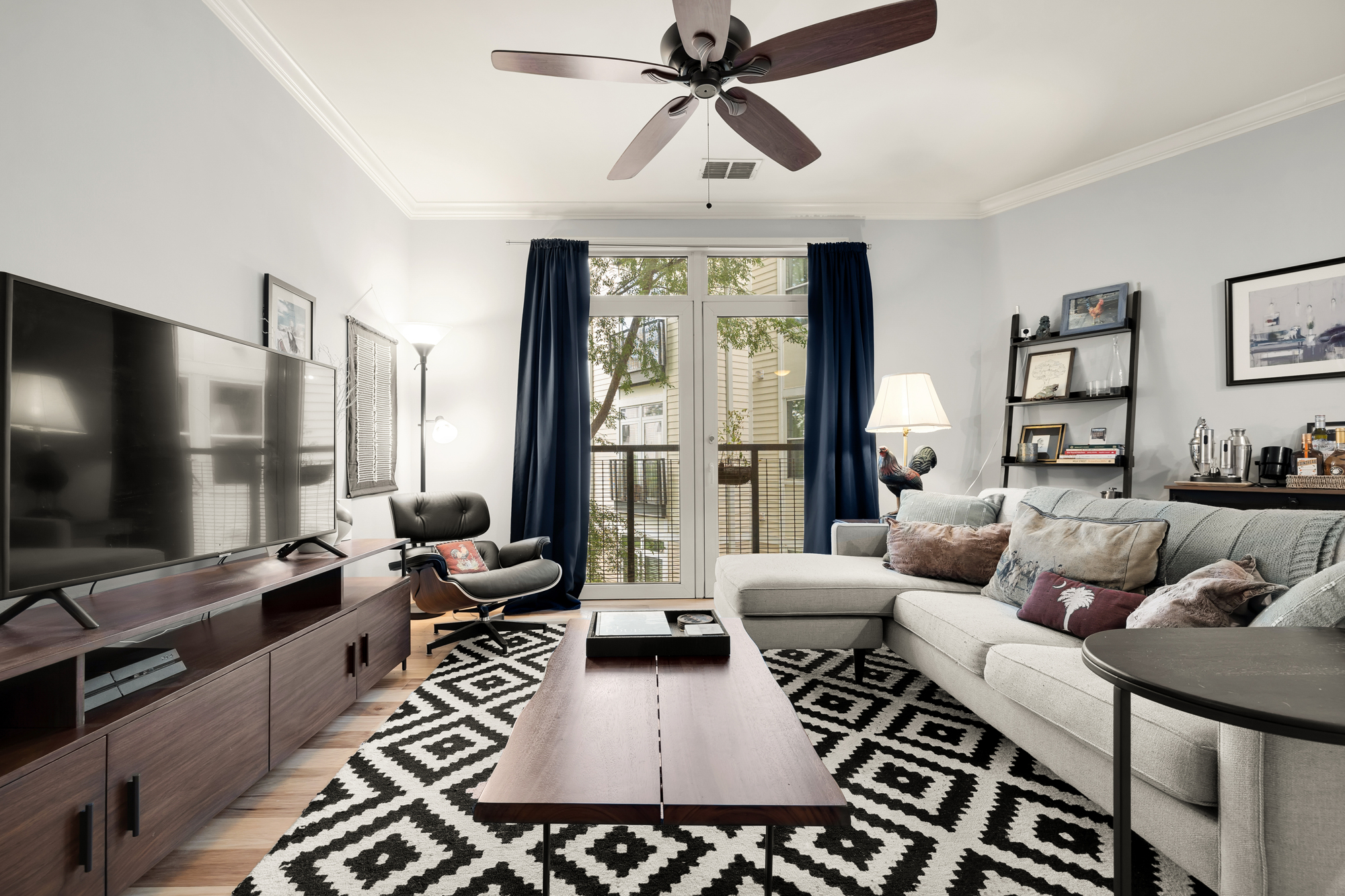 1391 Pennsylvania Ave. Southeast, Unit 324 Washington, DC 20003 - Photo 11 of 33 a living room with furniture and a flat screen tv