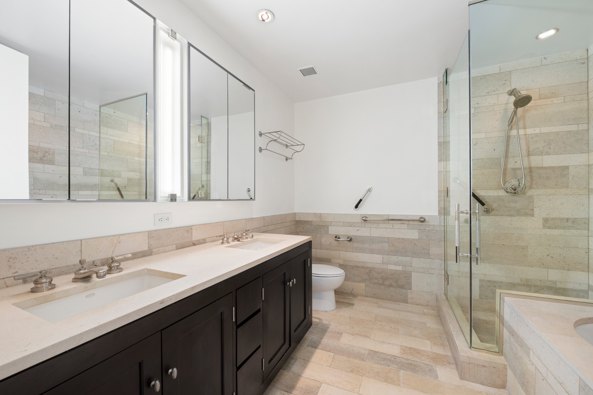 450 East 83rd Street, Unit 23B Manhattan, NY 10028 - Photo 8 of 18 a bathroom with a granite countertop sink mirror and double