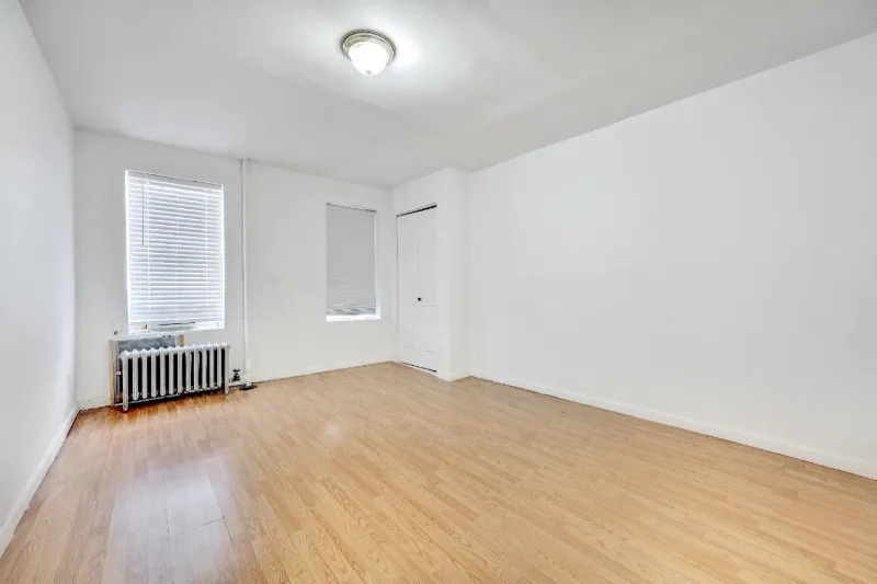255 Covert Street Brooklyn, NY 11207 - Photo 13 of 18 a view of empty room with wooden floor