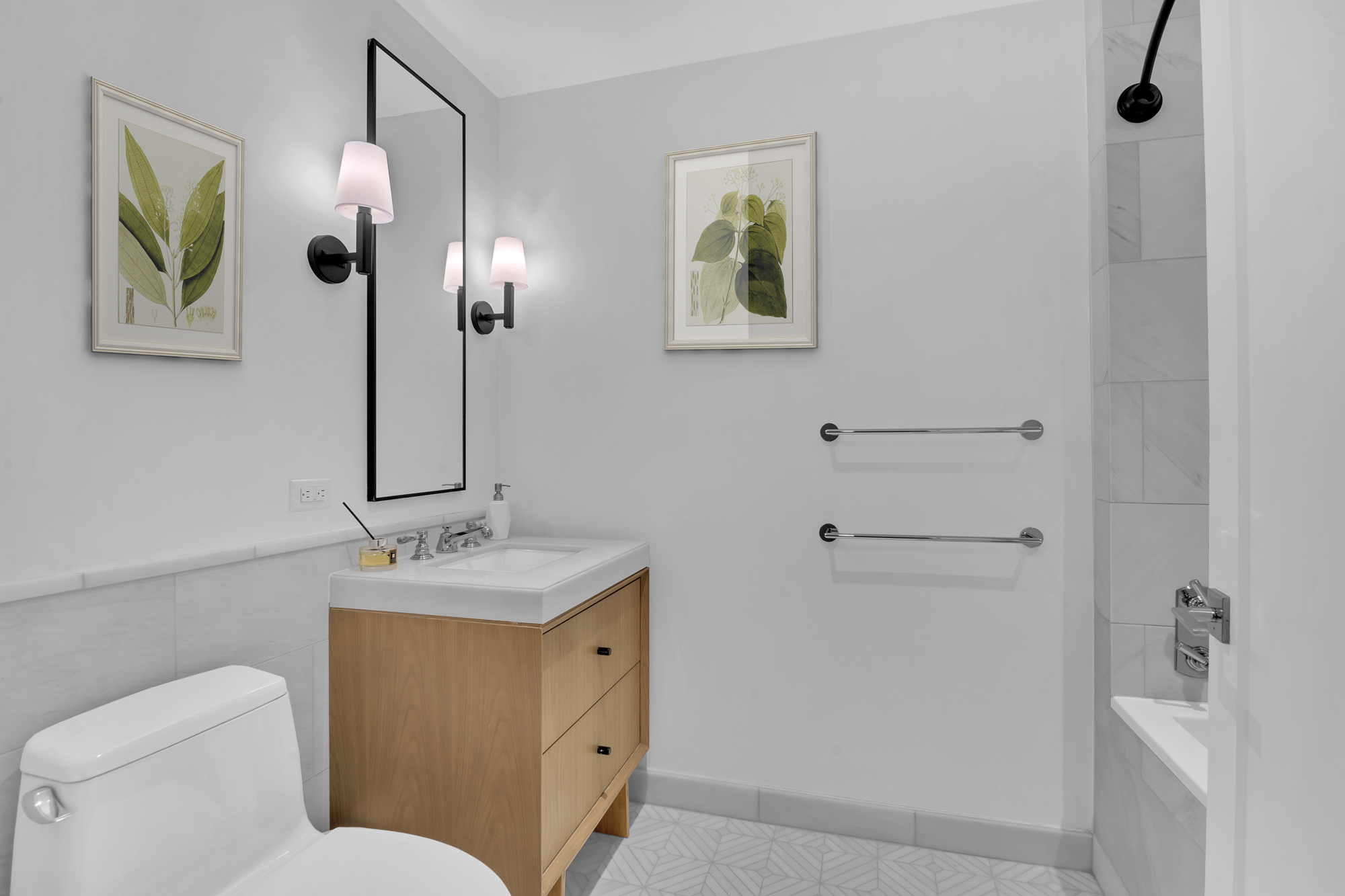 300 West 122nd Street, Unit 6R Manhattan, NY 10027 - Photo 6 of 23 a bathroom with a toilet sink and mirror