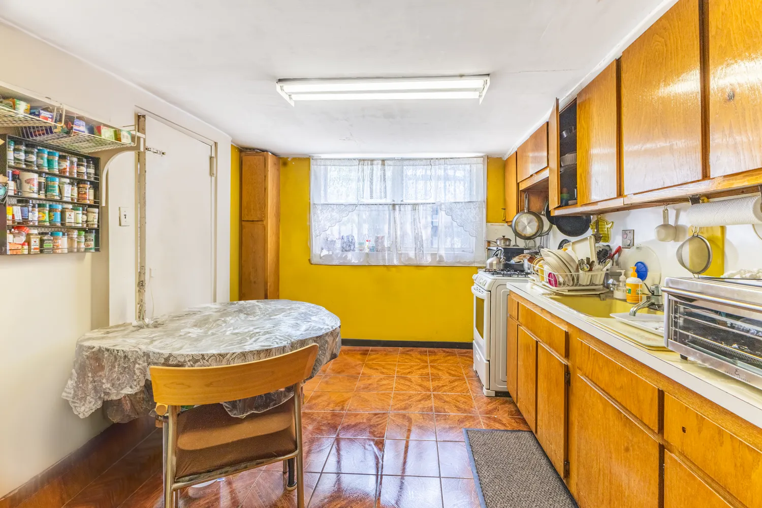 a backyard of a house with lots of green space and wooden fence