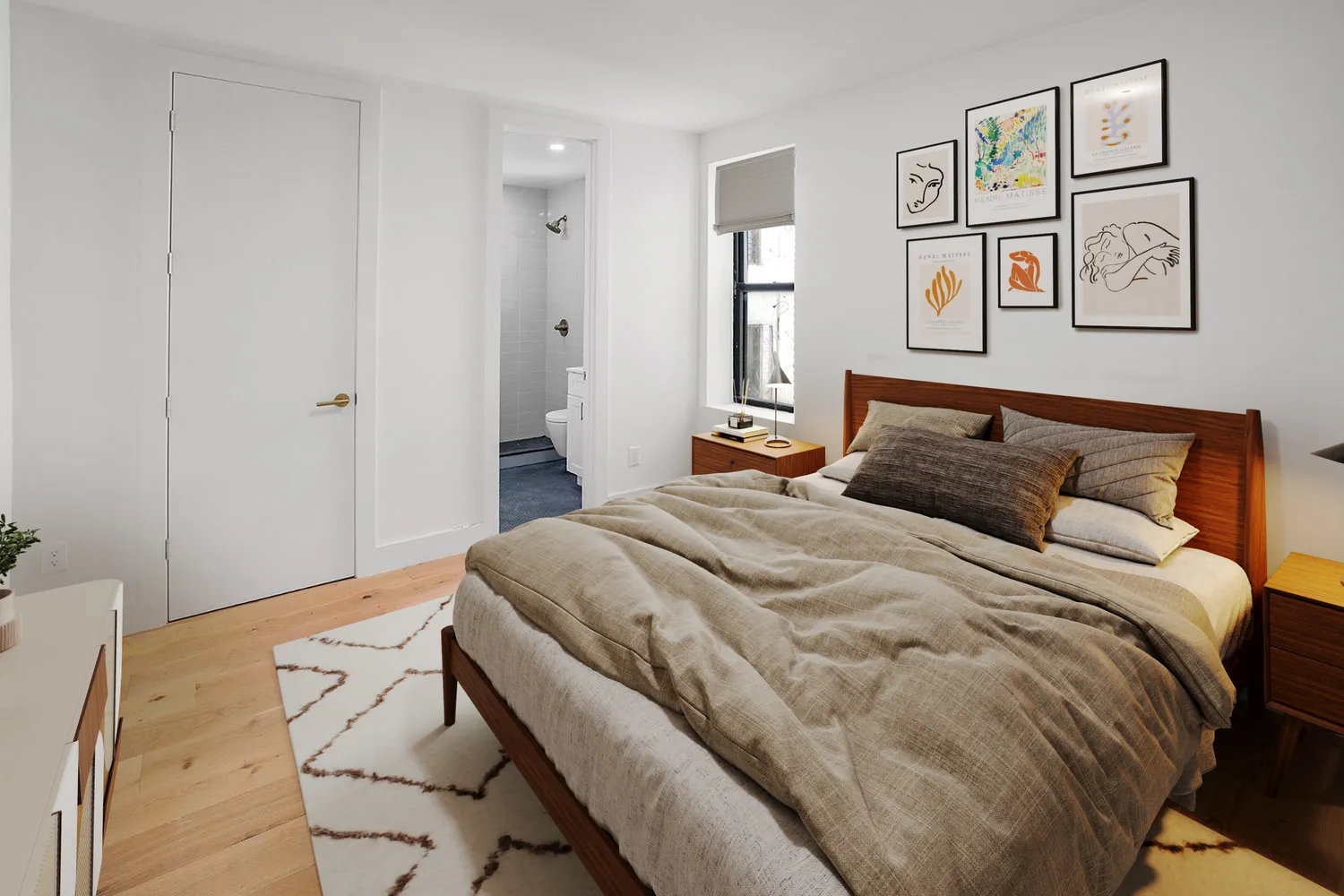 a bedroom with a bed and painting on the wall