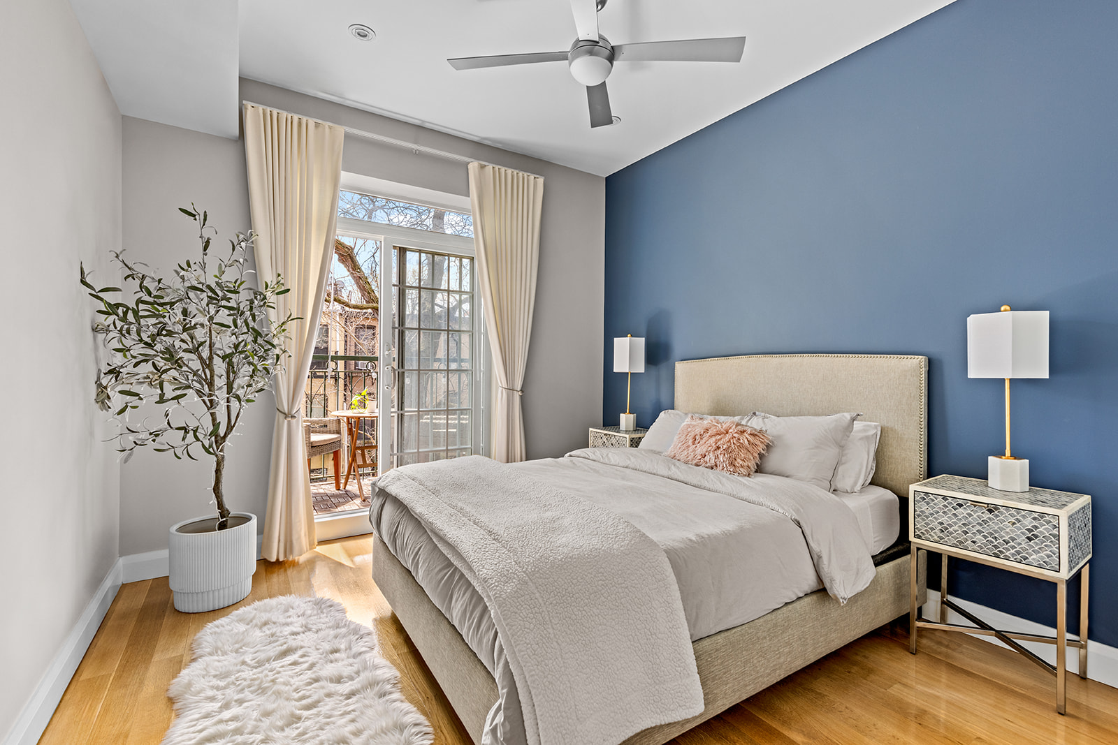 330 Bergen Street, Unit 3D Brooklyn, NY 11217 - Photo 7 of 11 a bedroom with a large bed and a lamp