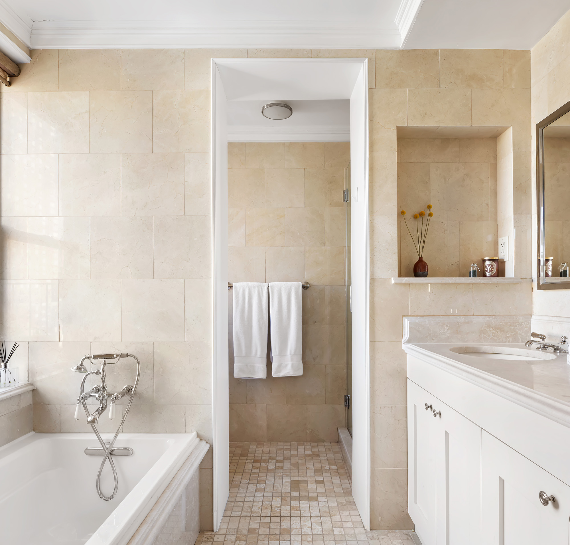 425 East 86th Street, Unit 11E Manhattan, NY 10028 - Photo 6 of 19 a bathroom with a sink and a mirror