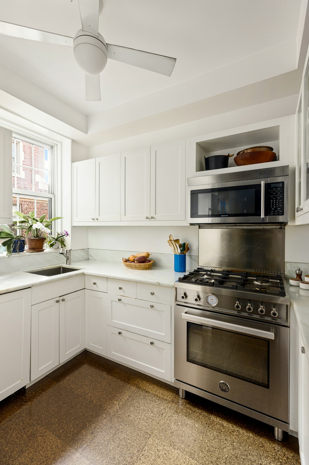 115 Willow Street, Unit 5A Brooklyn, NY 11201 - Photo 3 of 12 a kitchen with stainless steel appliances white cabinets and a stove top oven
