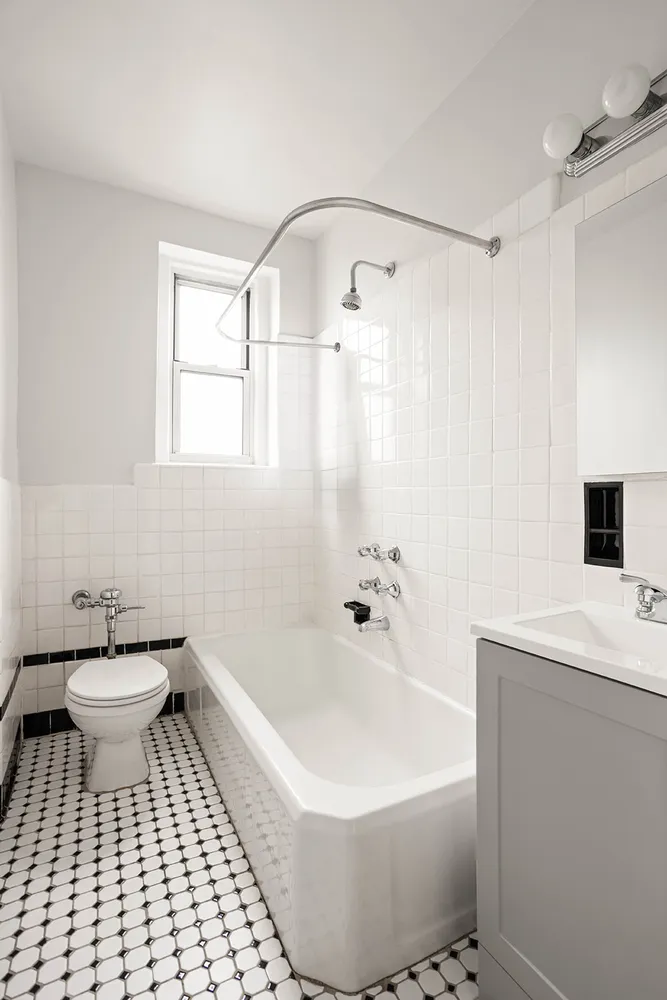 a bathroom with a bathtub and a toilet
