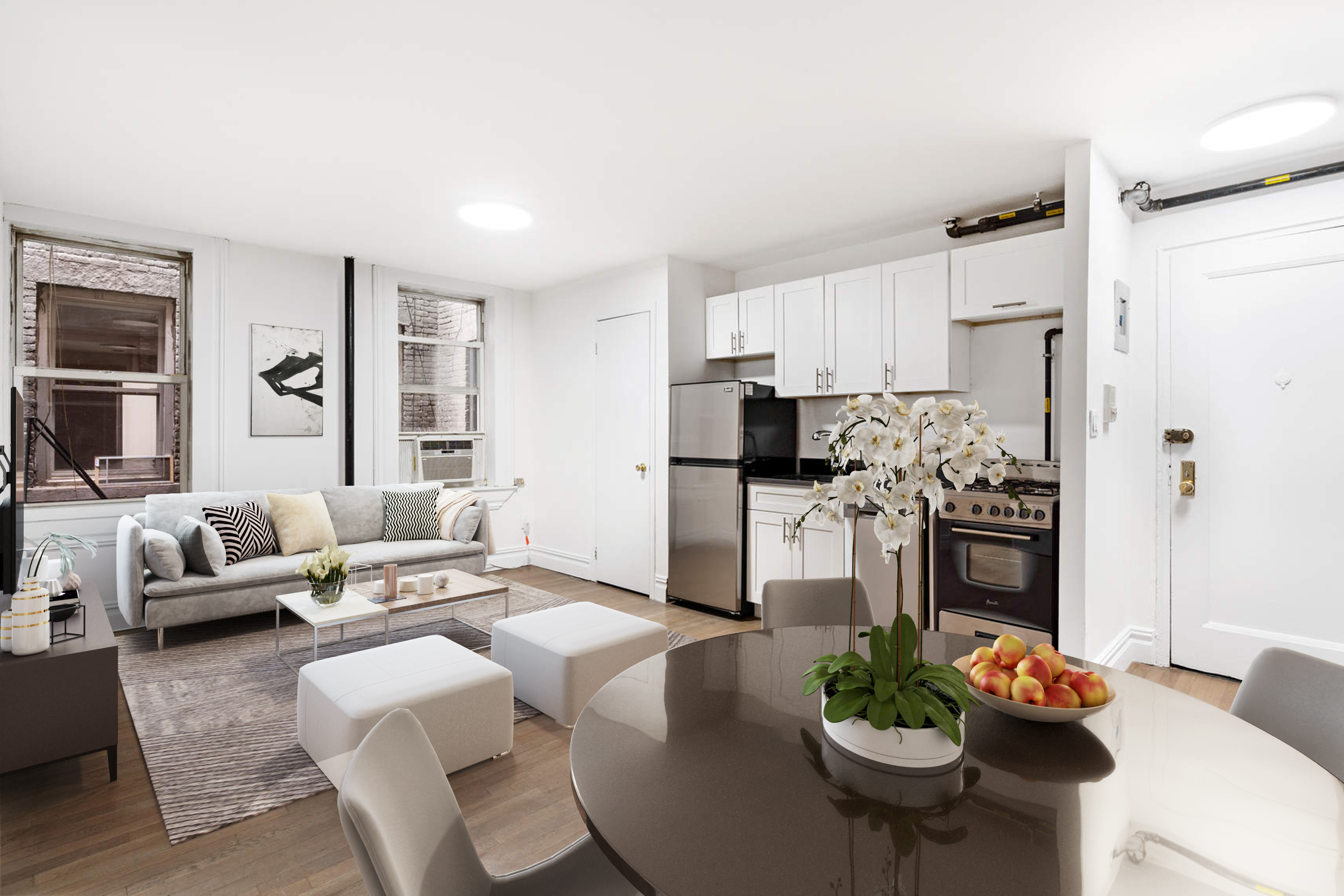 150 East 3rd Street, Unit 2D Manhattan, NY 10009 - Photo 2 of 4 a living room with stainless steel appliances furniture a dining table and chairs