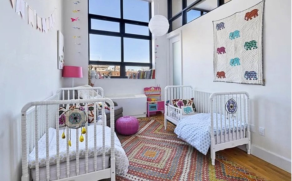 360 Furman Street, Unit 511 Brooklyn, NY 11201 - Photo 5 of 37 a bedroom with furniture and a rug