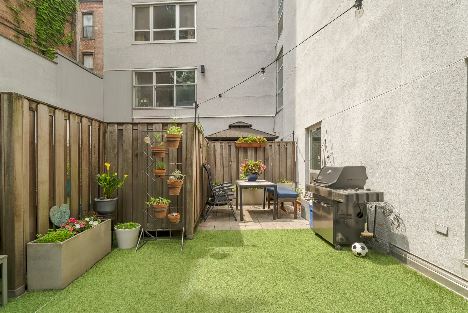 a living room with furniture and a floor to ceiling window