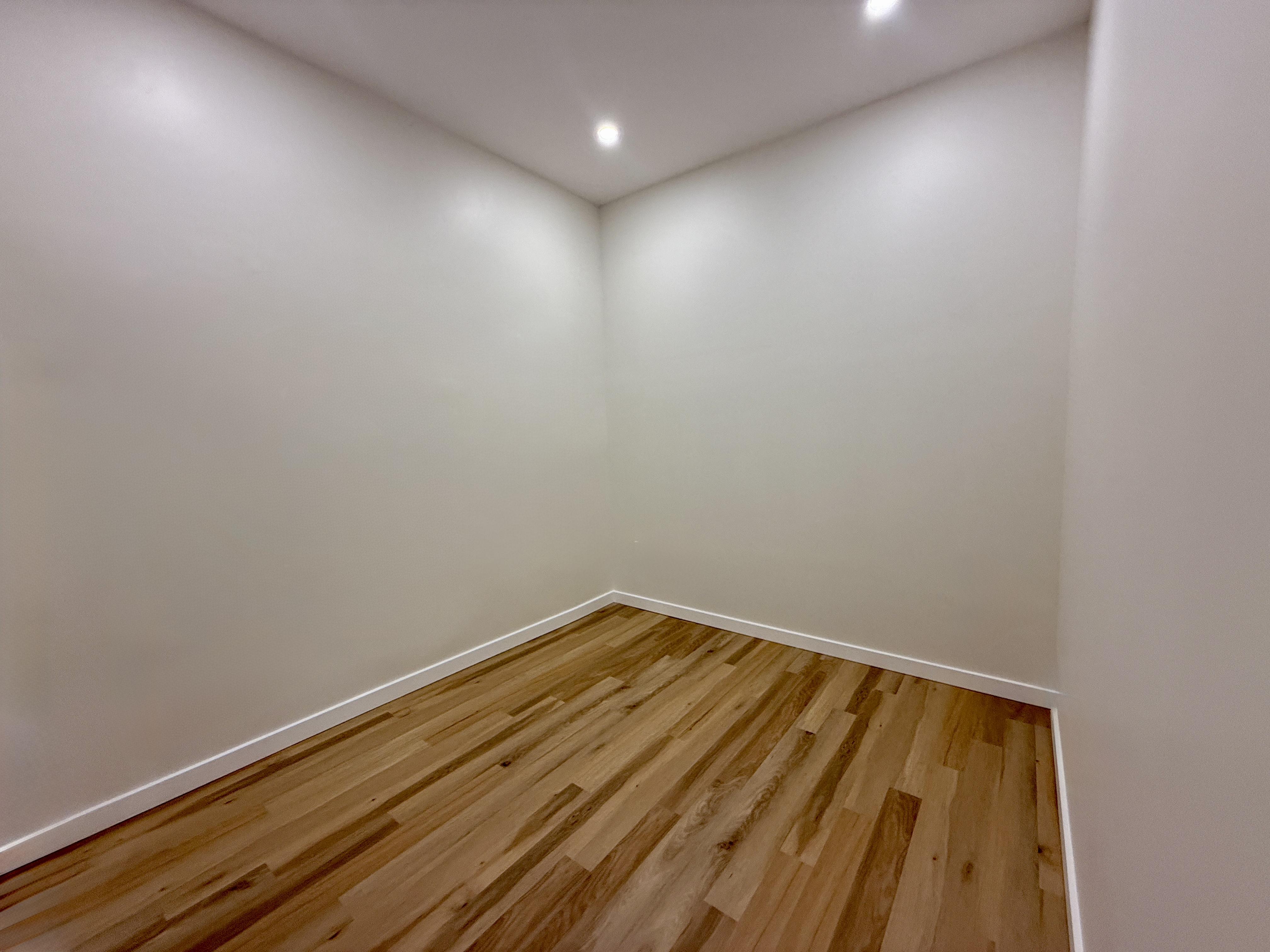139 Autumn Avenue, Unit 1 Brooklyn, NY 11208 - Photo 10 of 14 a view of room with wooden floor