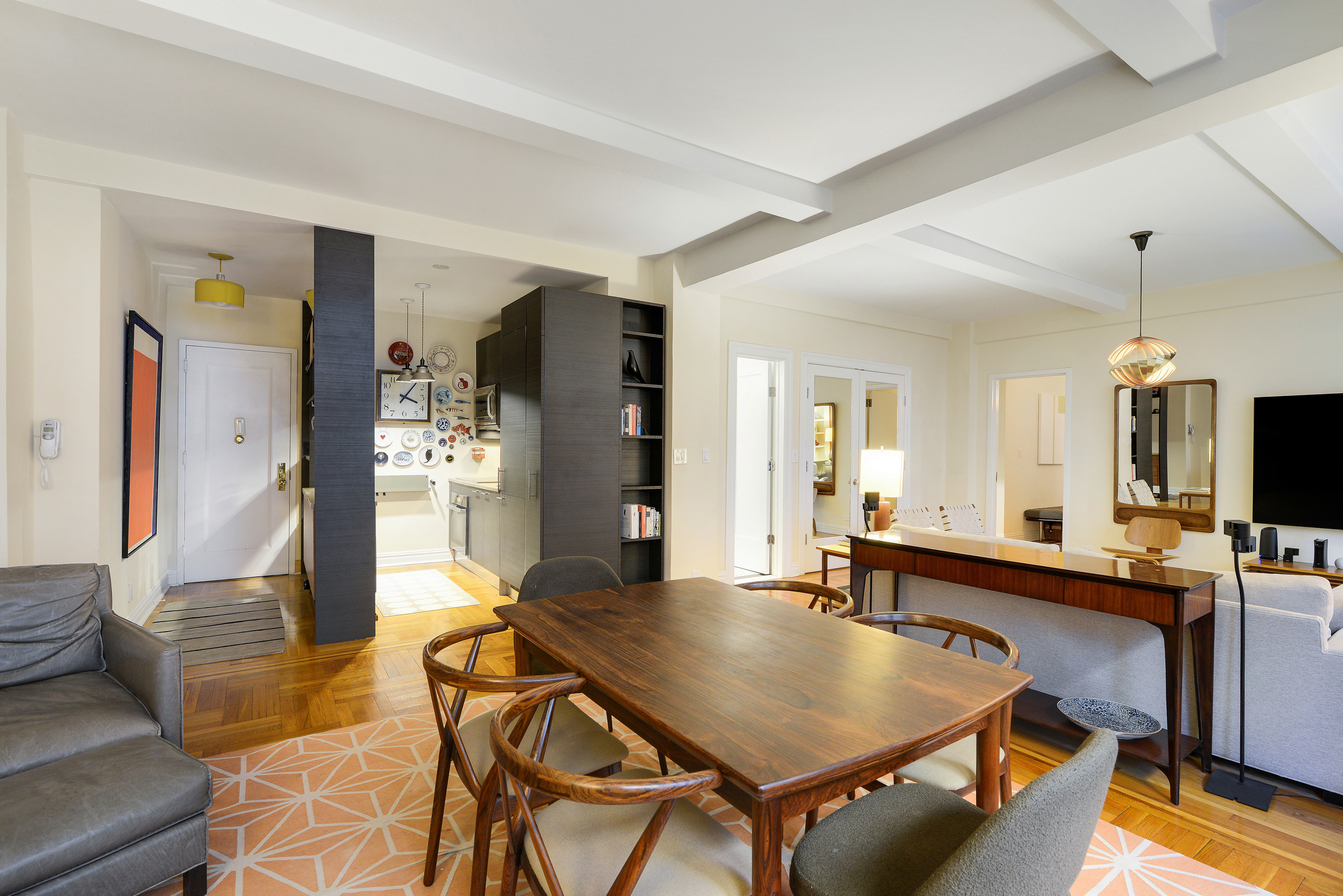 20 West 72nd Street, Unit 601 Manhattan, NY 10023 - Photo 6 of 21 a room with dining table and chairs