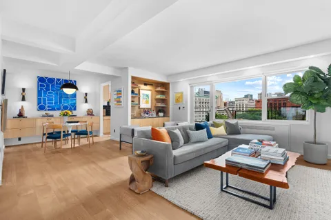 a living room with furniture and a table