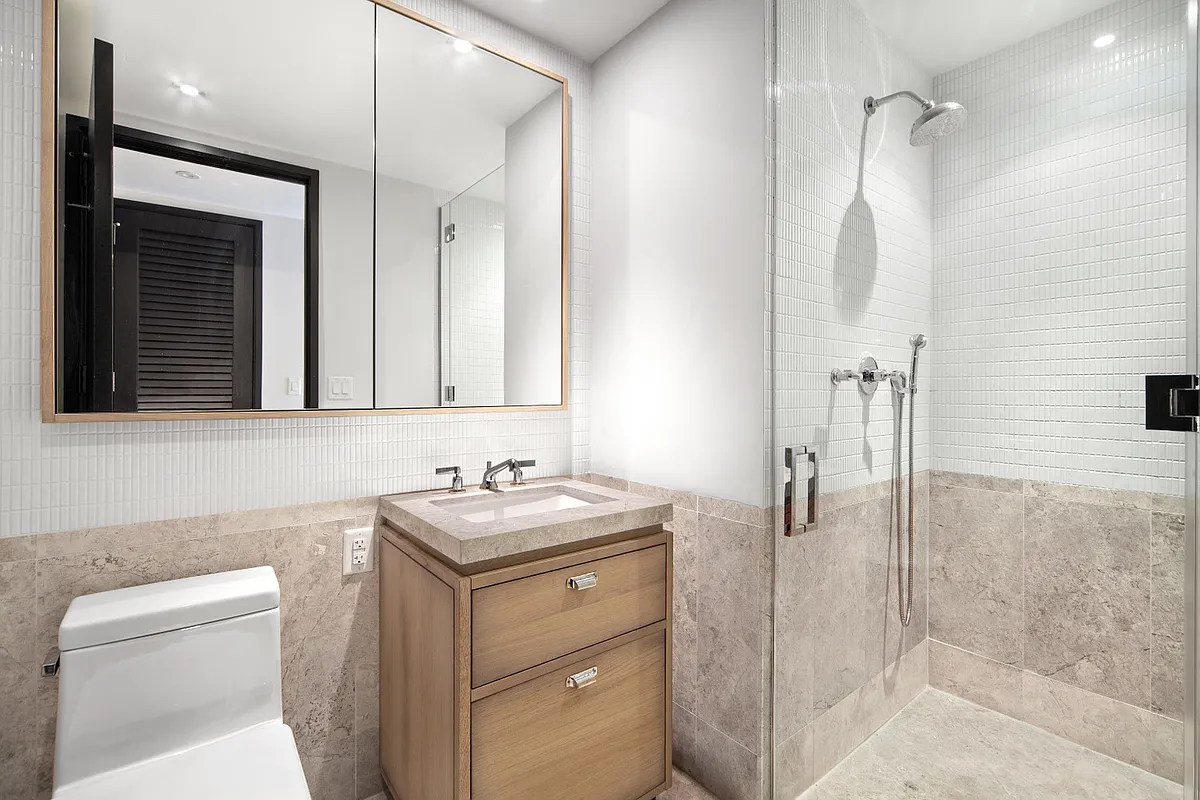 51 Jay Street, Unit 5D Brooklyn, NY 11201 - Photo 9 of 13 a bathroom with a sink toilet and shower