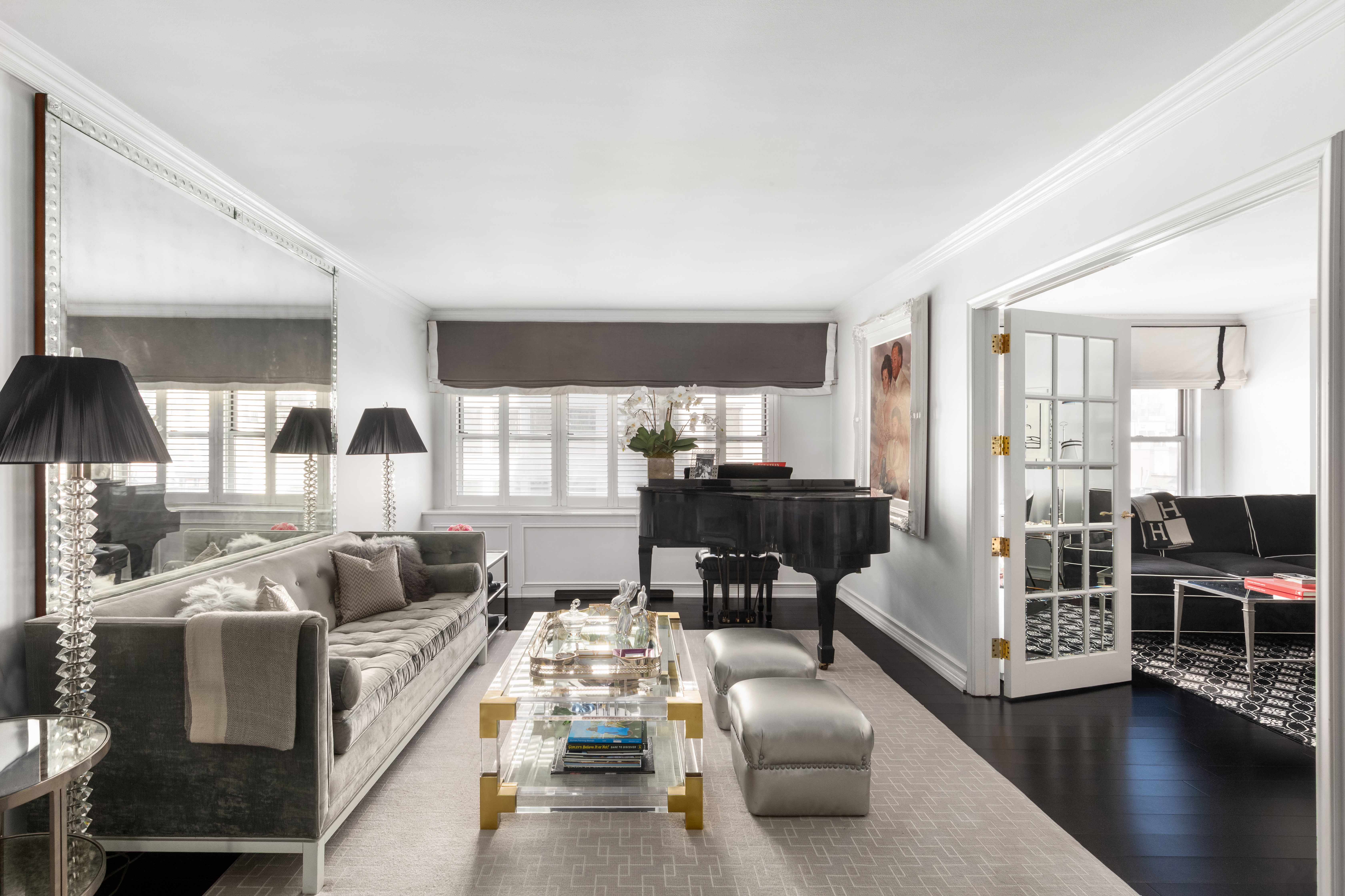 27 East 65th Street, Unit 10BC Manhattan, NY 10065 - Photo 2 of 16 a living room with furniture and wooden floor