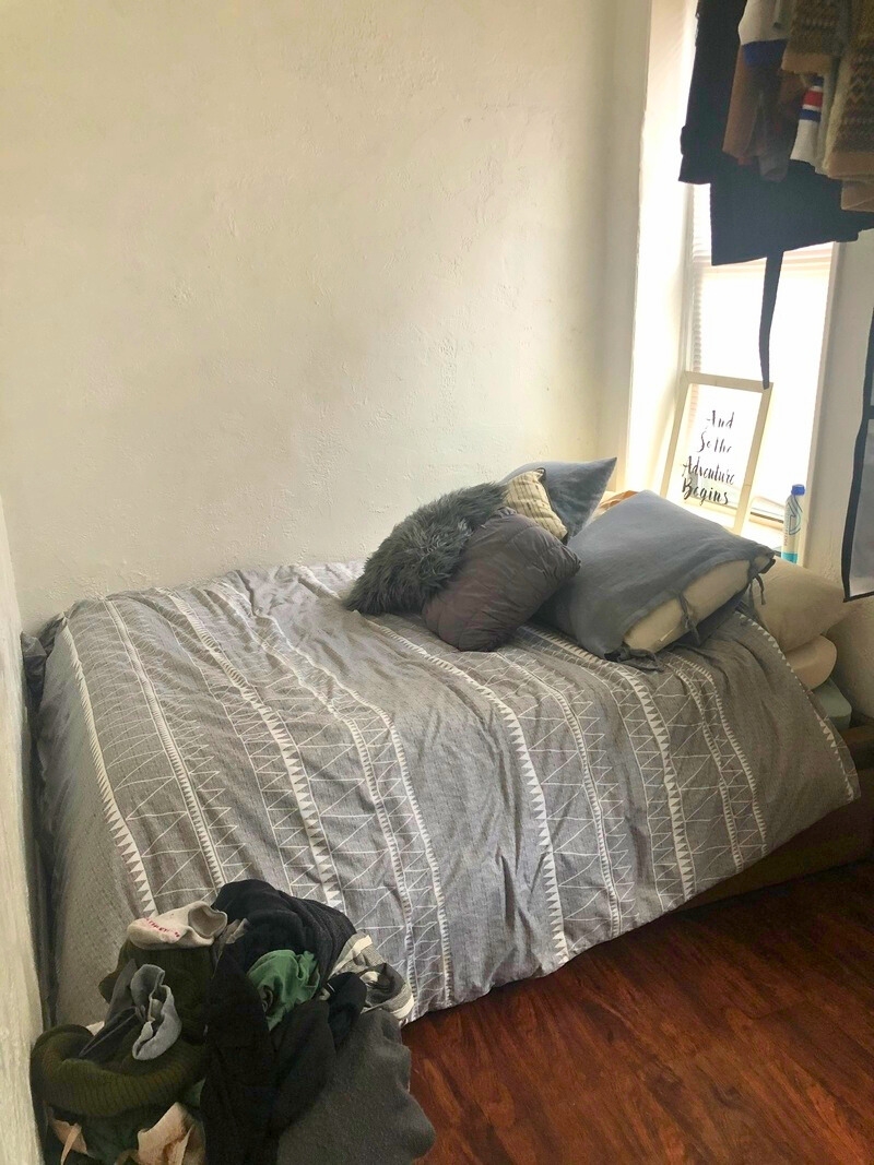 64 MacDougal Street, Unit 2 Manhattan, NY 10012 - Photo 4 of 4 a bedroom with a bed and a window