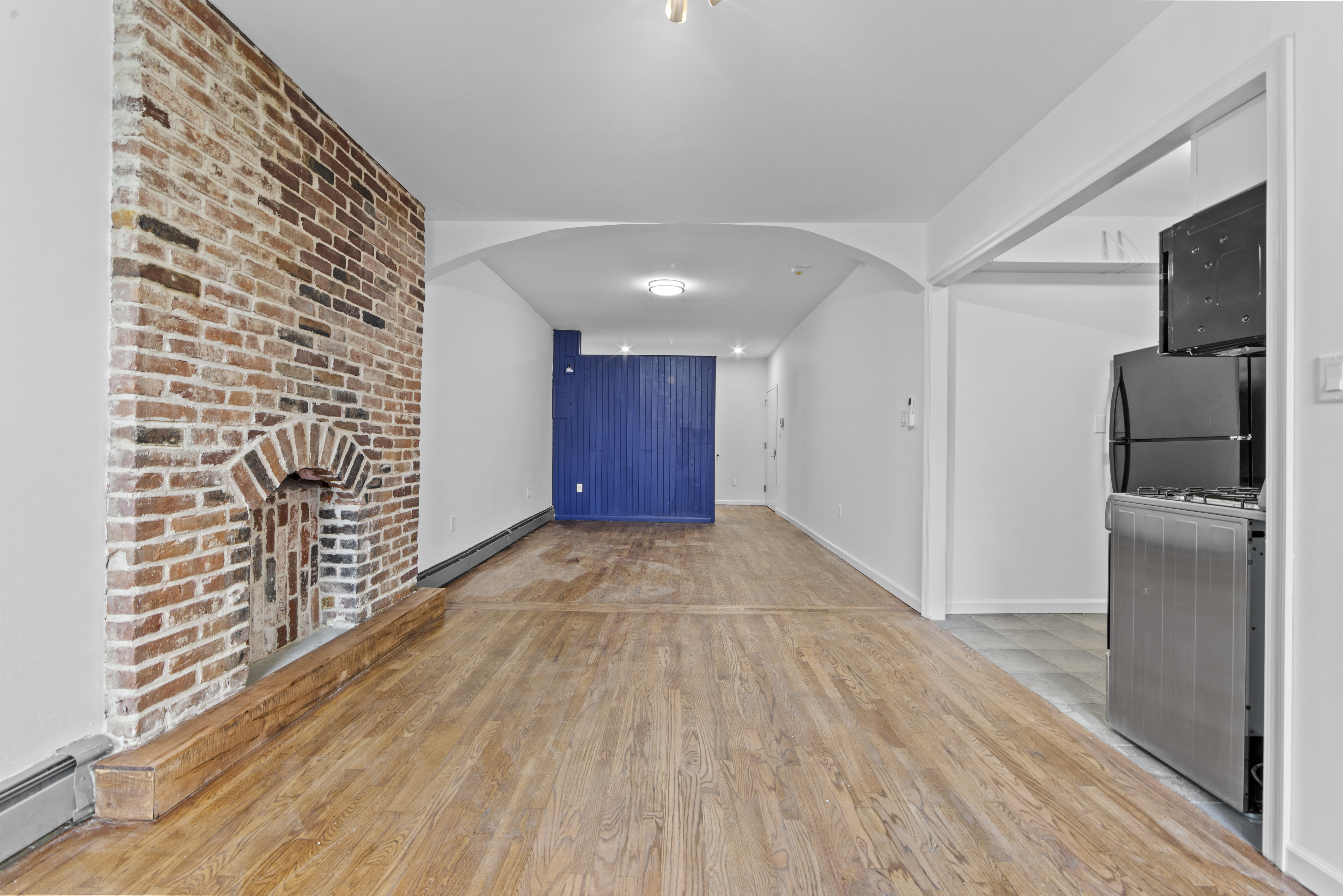1061 Fulton Street, Unit 3 Brooklyn, NY 11238 - Photo 3 of 14 a view of empty room with wooden floor
