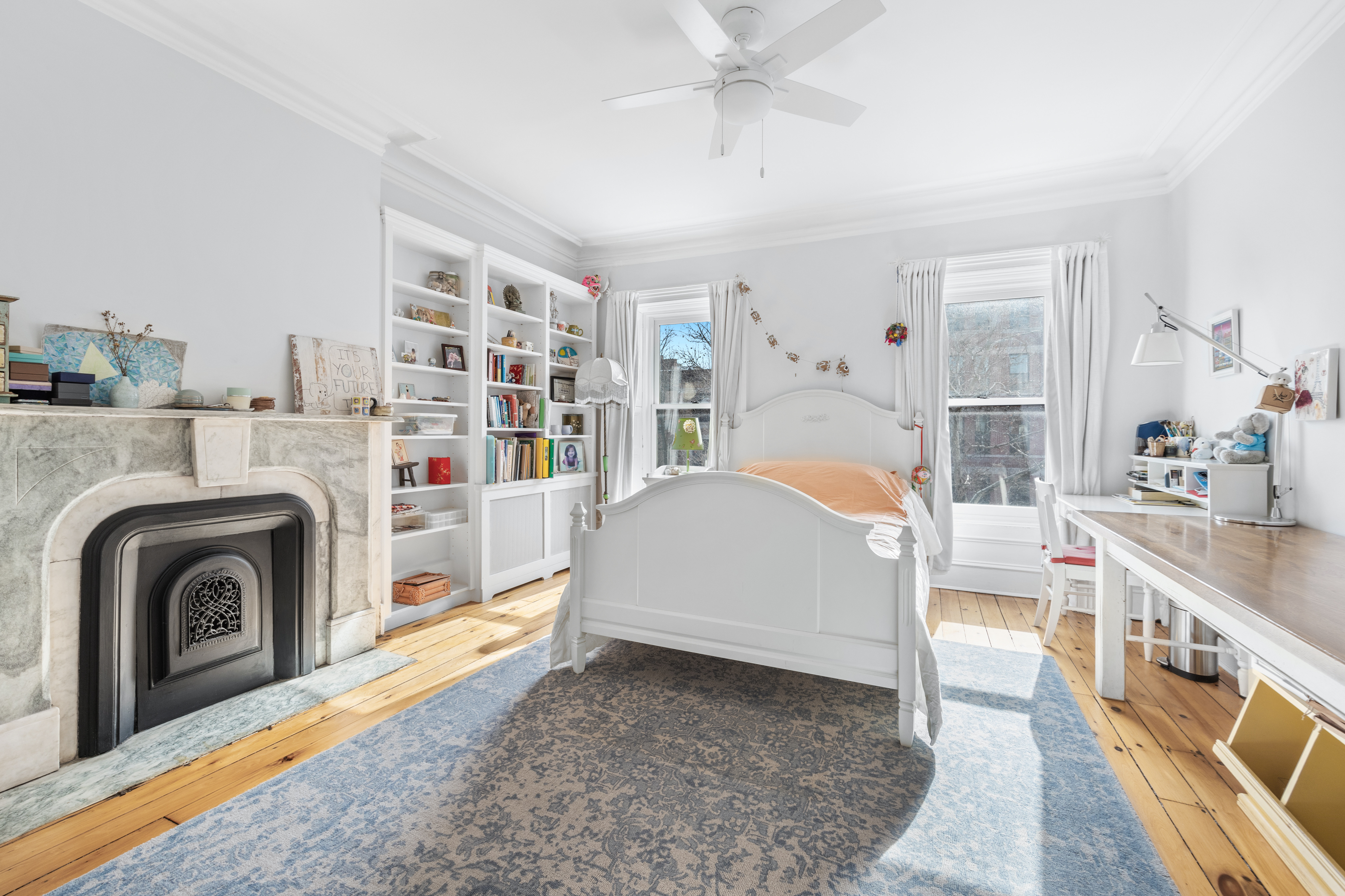 387 Union Street, Unit 2 Brooklyn, NY 11231 - Photo 9 of 12 a bedroom with furniture and a fireplace