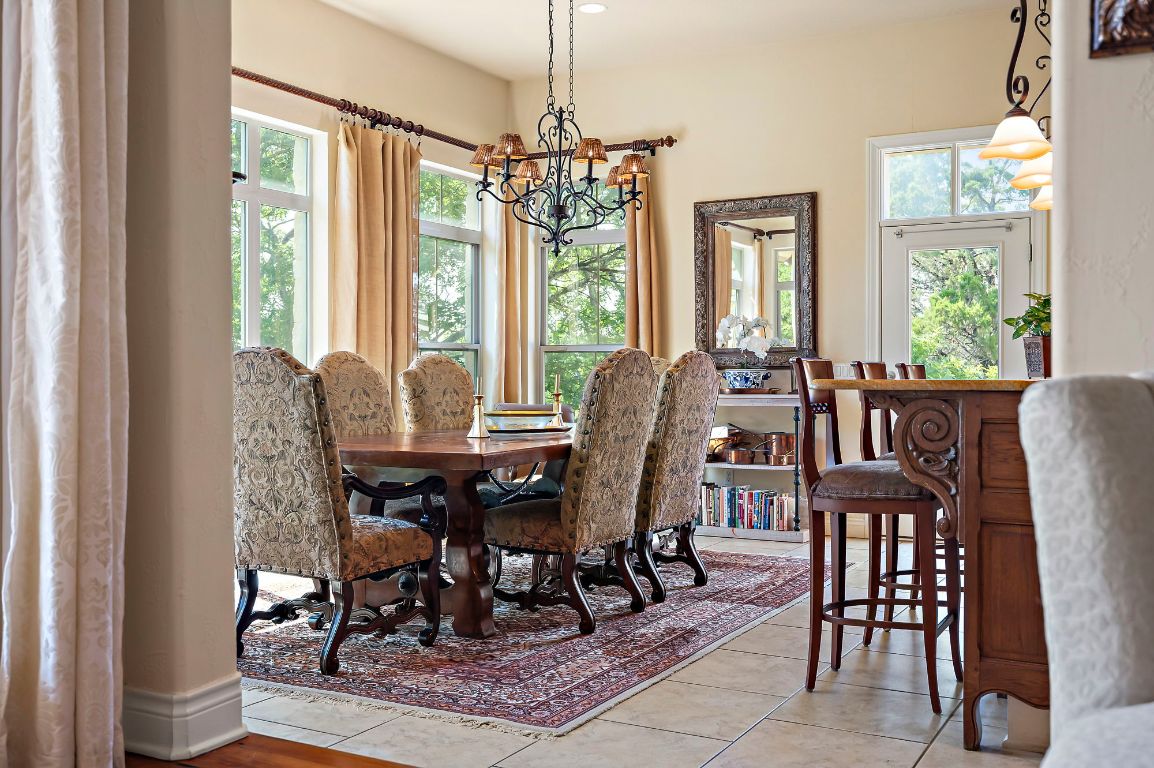 1607 The High Road Austin, TX 78746 - Photo 8 of 28 a view of a dining room with furniture window and outside view