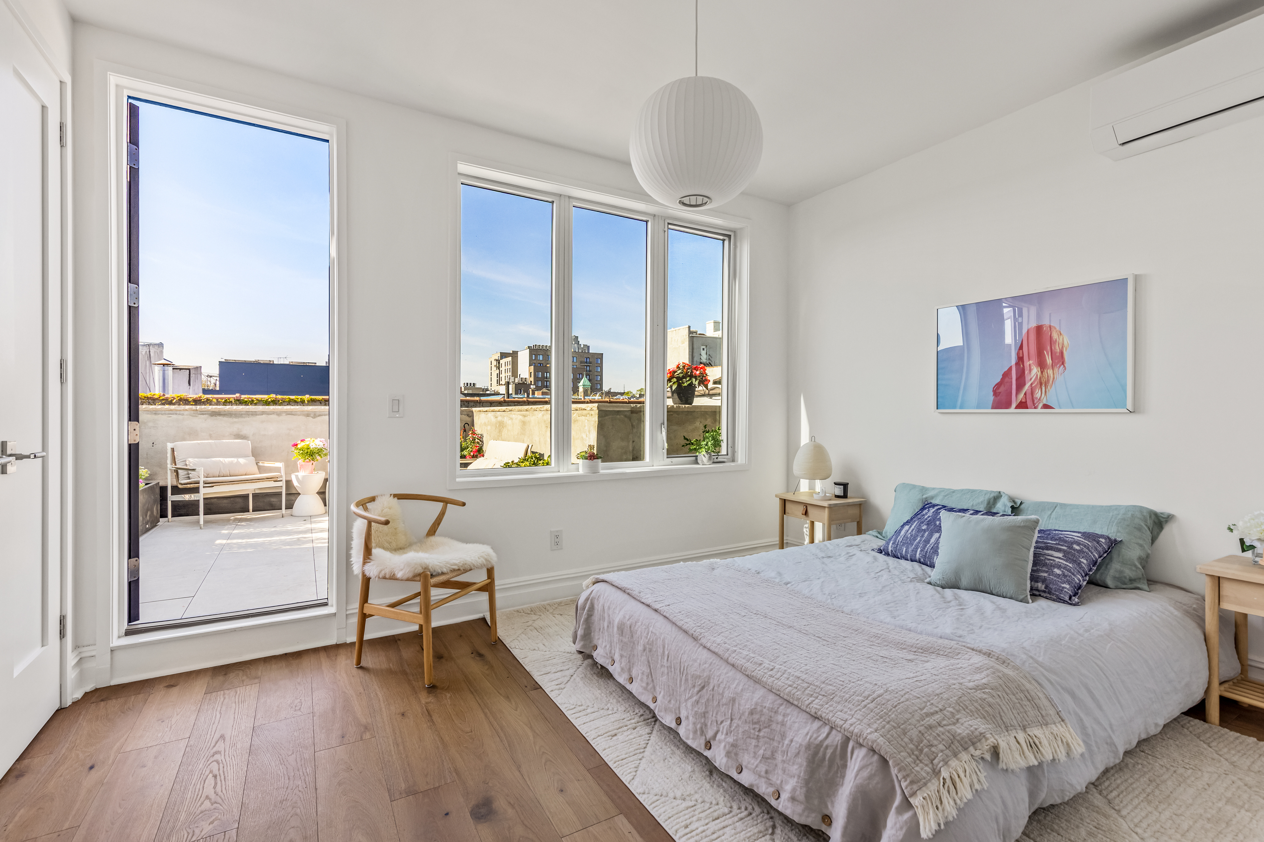 744 Park Place, Unit 4A Brooklyn, NY 11216 - Photo 5 of 13 a bedroom with a large bed and a window