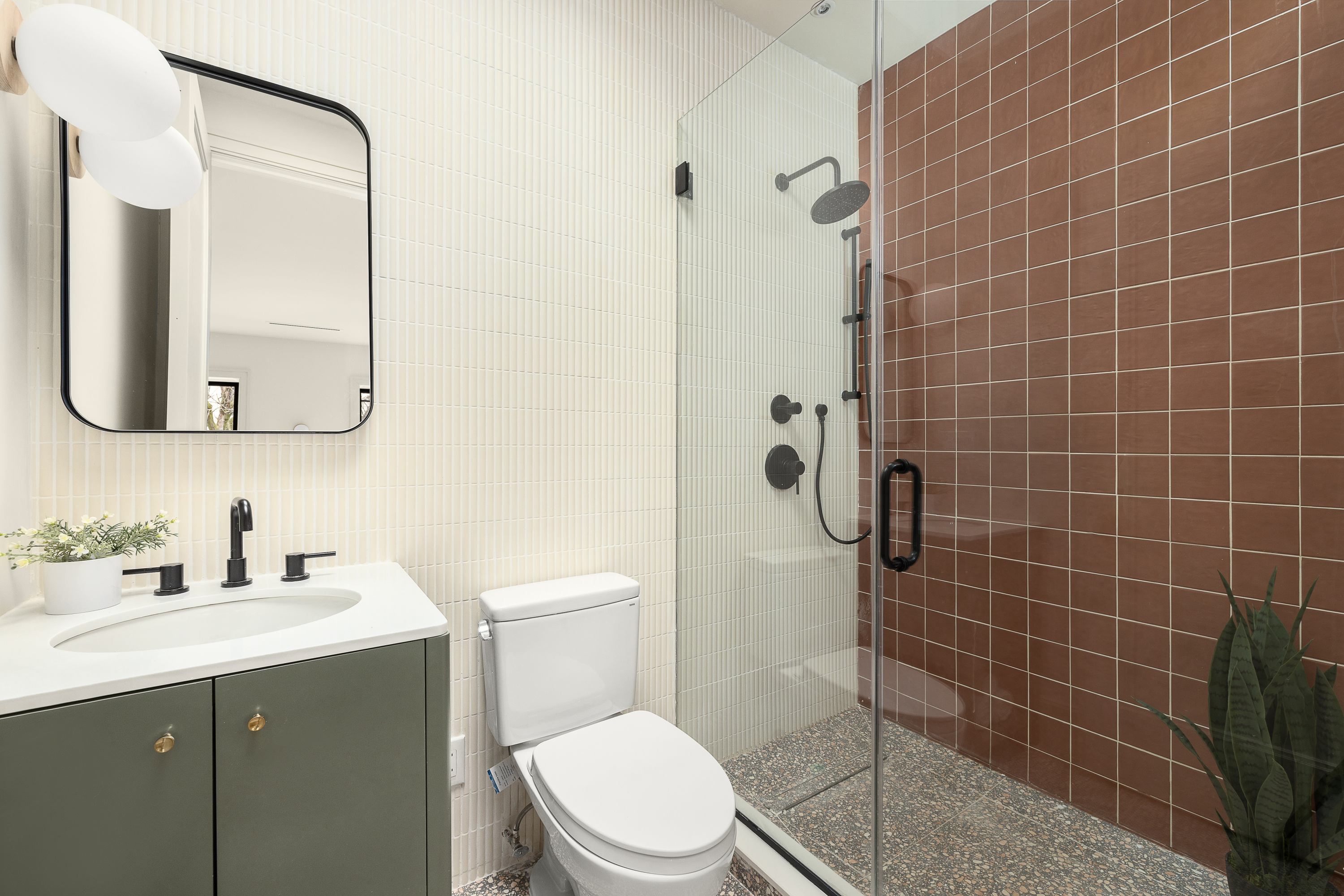 167 Quincy Street Brooklyn, NY 11216 - Photo 15 of 20 a bathroom with a toilet a sink a mirror and shower