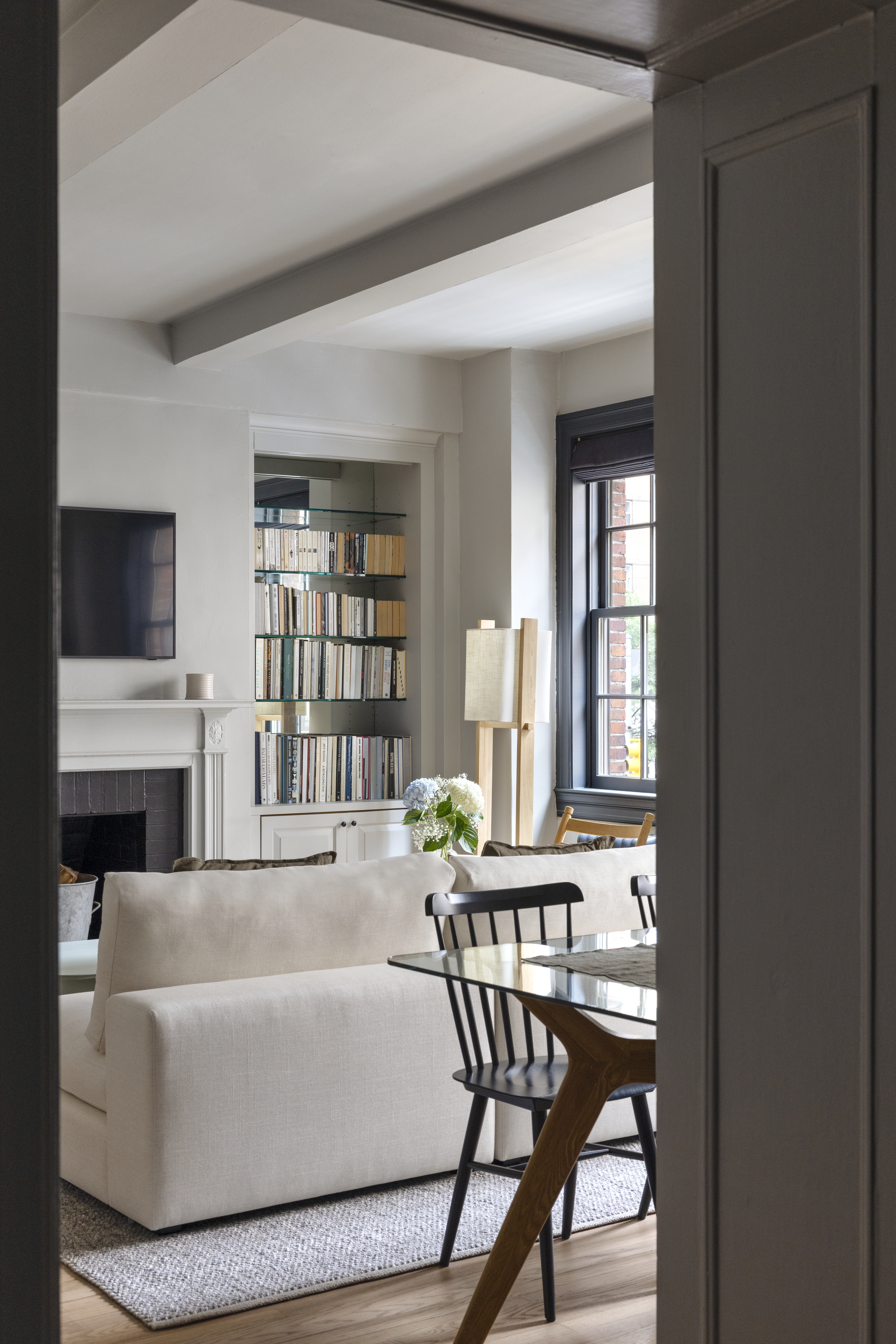 264 Lexington Avenue, Unit 3A Manhattan, NY 10016 - Photo 5 of 12 a living room with furniture a fireplace and a window