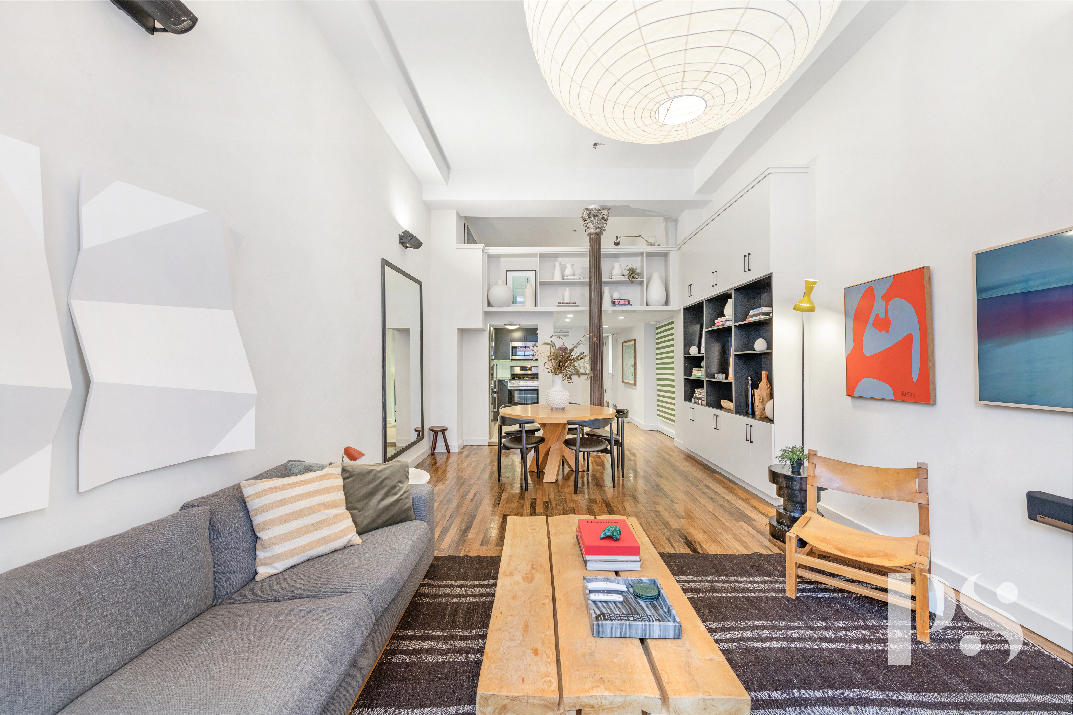 67 East 11th Street, Unit 517 Manhattan, NY 10003 - Photo 5 of 13 a living room with furniture and a rug