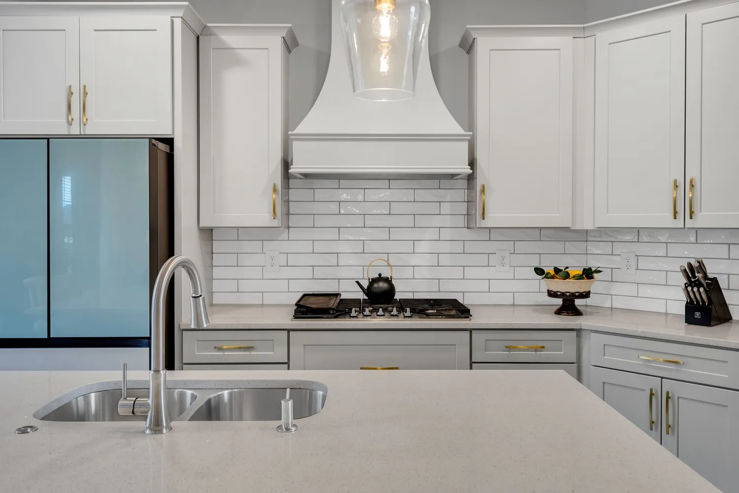 a kitchen with a sink and cabinets
