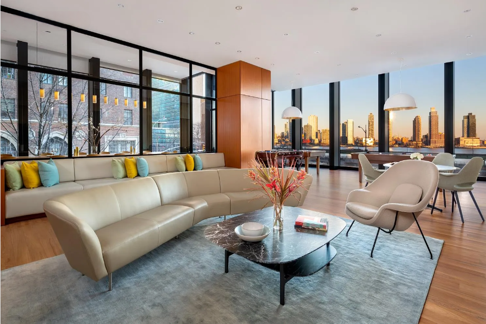 695 1st Avenue, Unit 33B Manhattan, NY 10016 - Photo 19 of 25 a living room with furniture and a large window