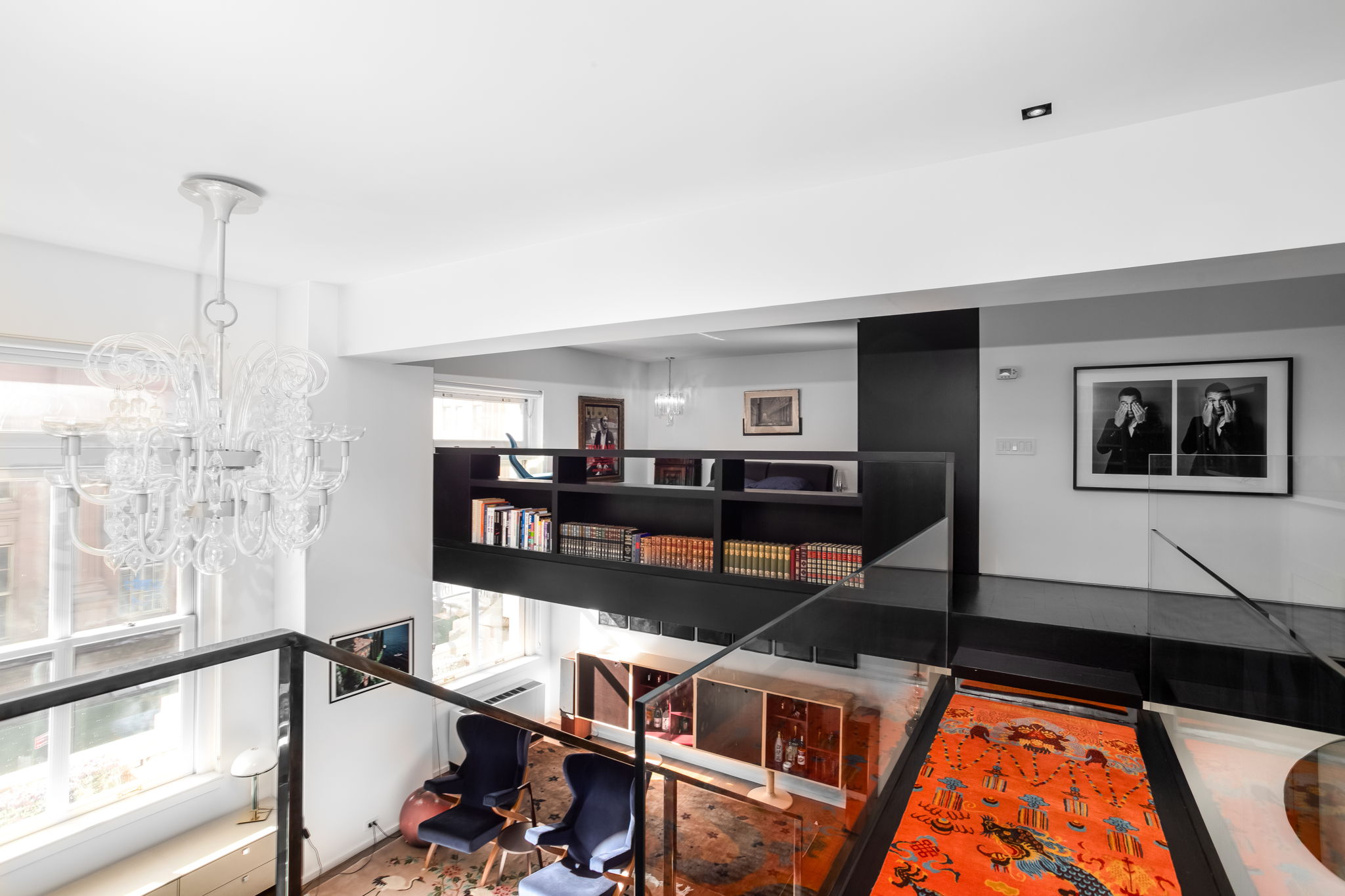 240 Centre Street, Unit 3H Manhattan, NY 10013 - Photo 6 of 20 a living room with furniture and a floor to ceiling window