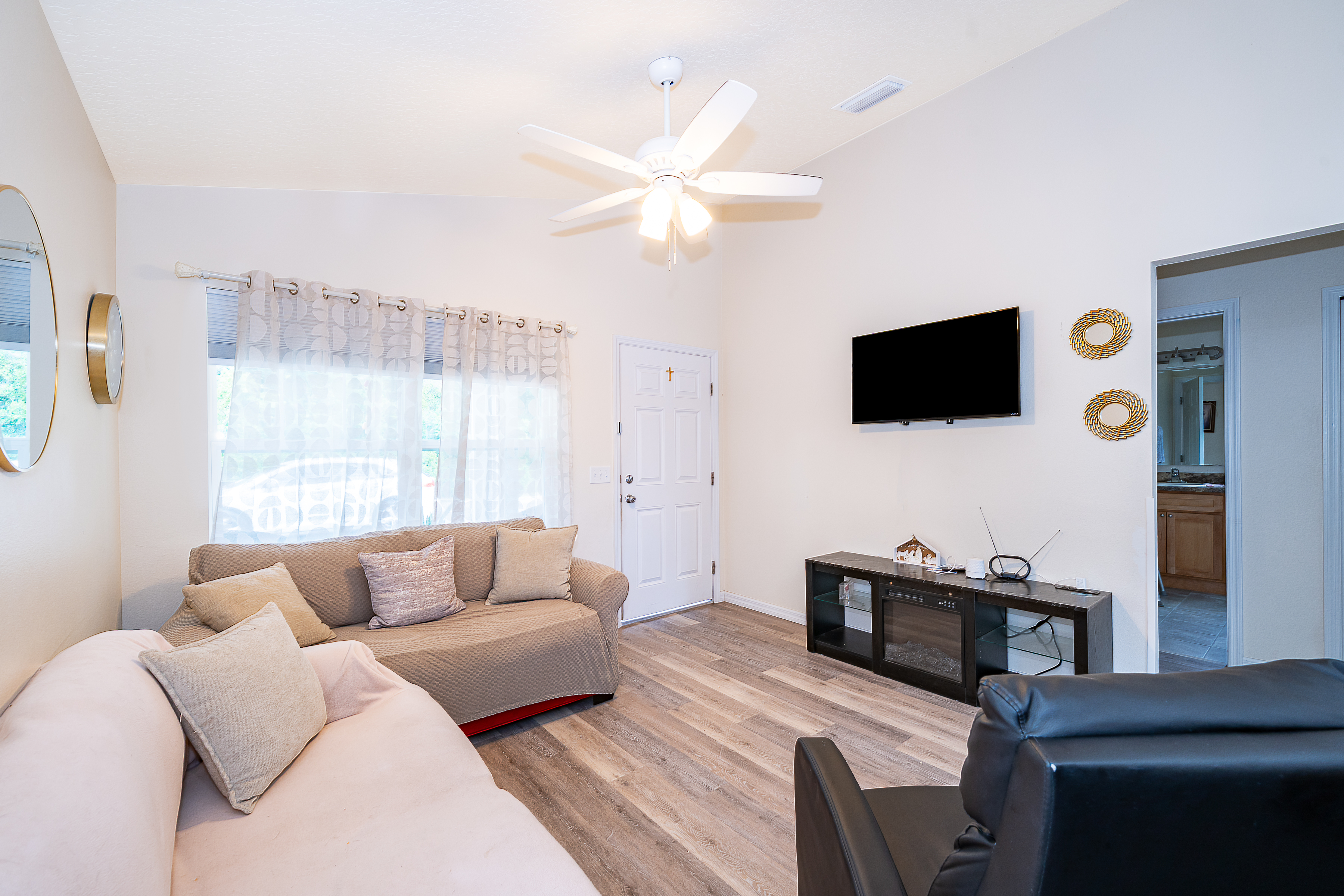 1360 Cottage Circle Tavares, FL 32778 - Photo 4 of 25 a living room with furniture and a flat screen tv