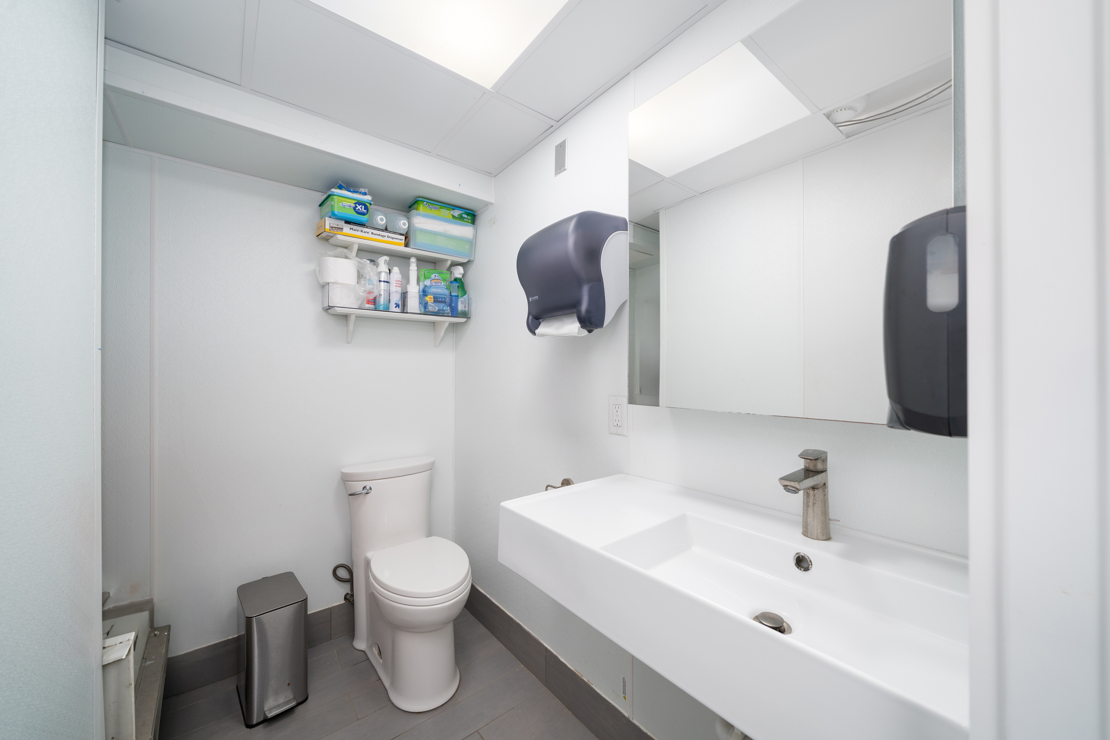 155 3rd Street Hoboken, NJ 07030 - Photo 14 of 18 a bathroom with a toilet sink and mirror