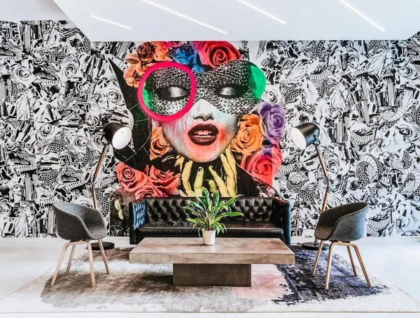 a street sign on a wall in front of building