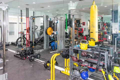 a couple of cars parked in front of brick building