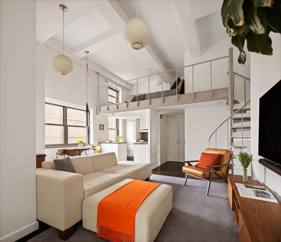 a bedroom with furniture and a window