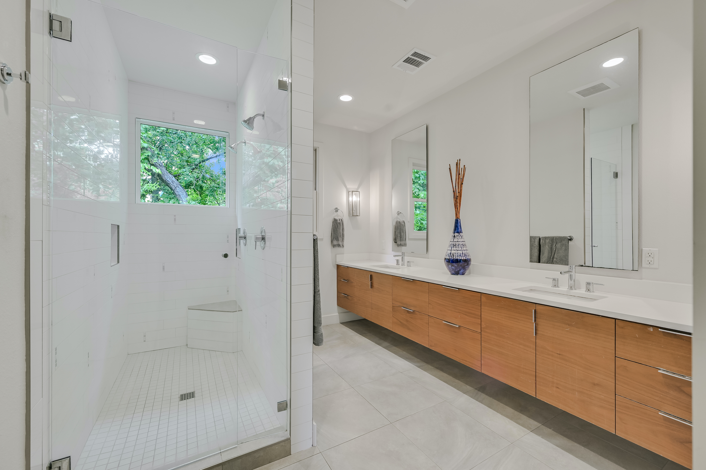 500 South 3rd Street, Unit A Austin, TX 78704 - Photo 15 of 24 a bathroom with a double vanity sink and a mirror