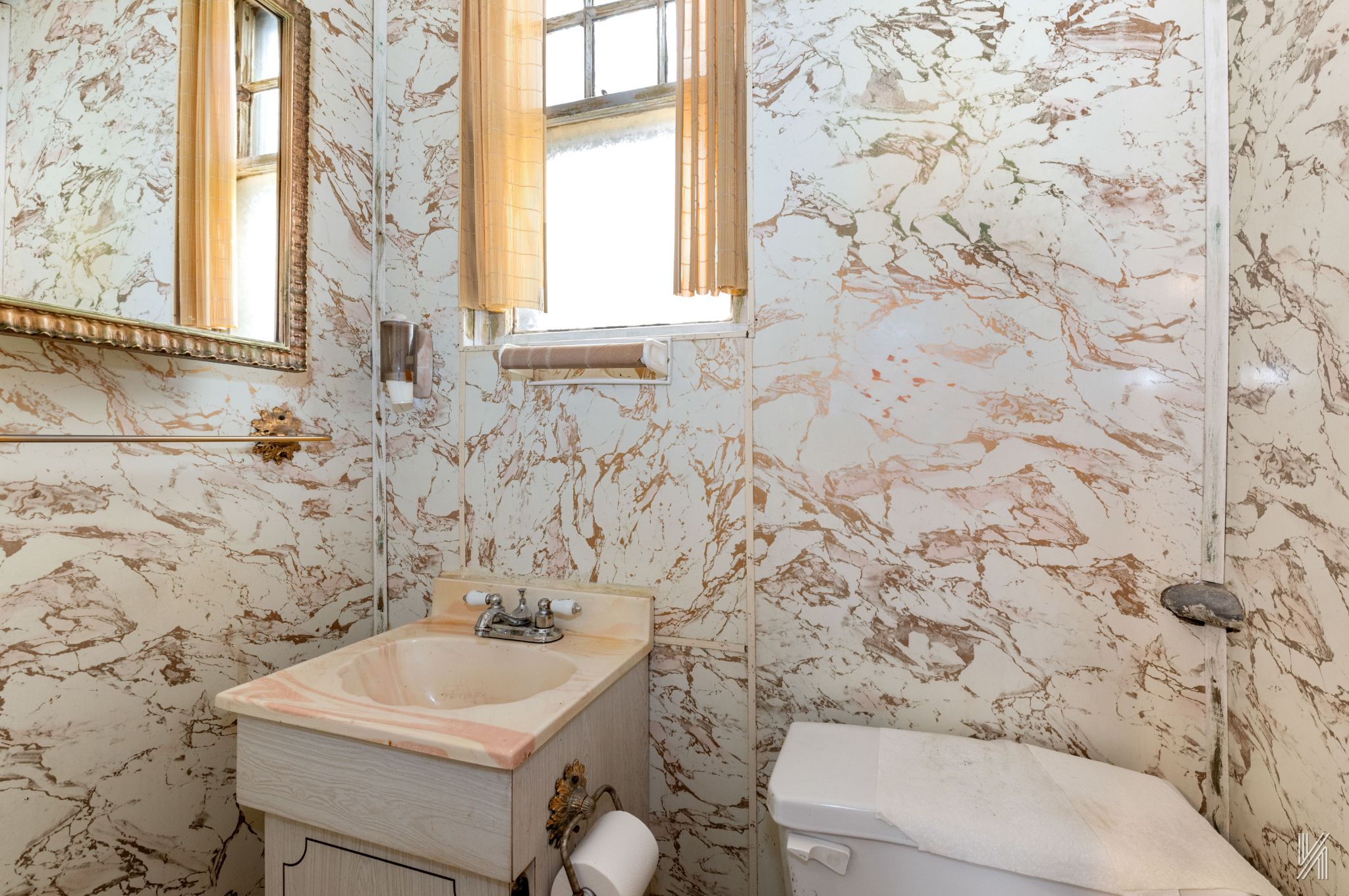 135-16 95th Street Queens, NY 11417 - Photo 16 of 21 a bathroom with a sink and a toilet