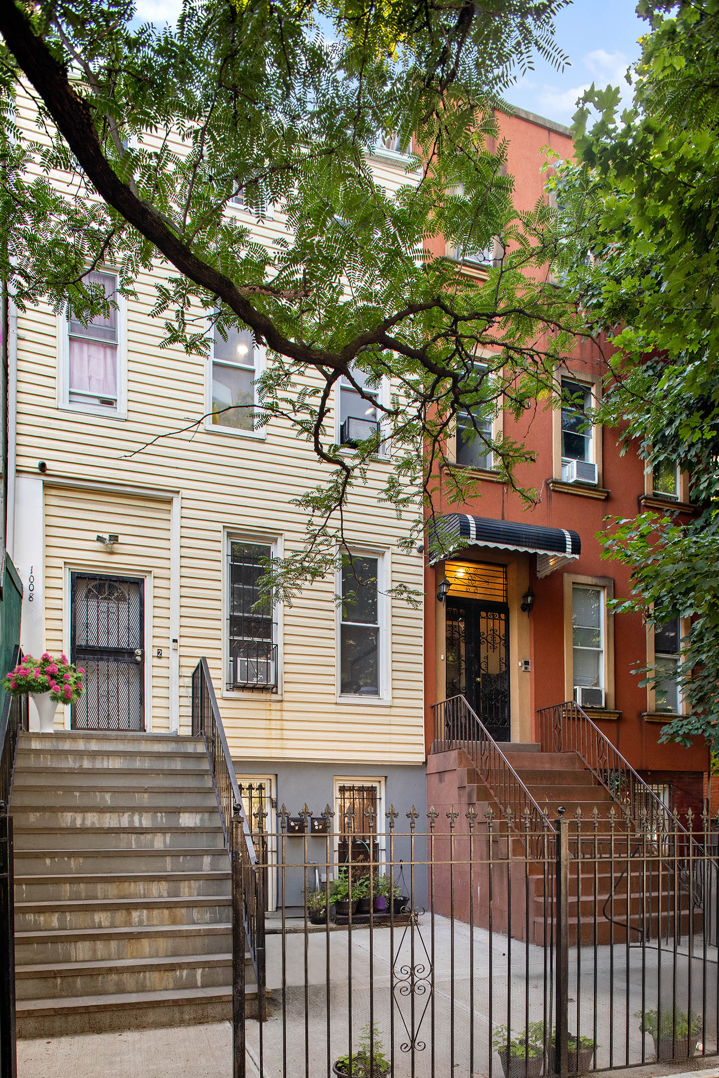 1008 Bushwick Avenue Brooklyn, NY 11221 - Photo 10 of 11 a front view of a house with a tree