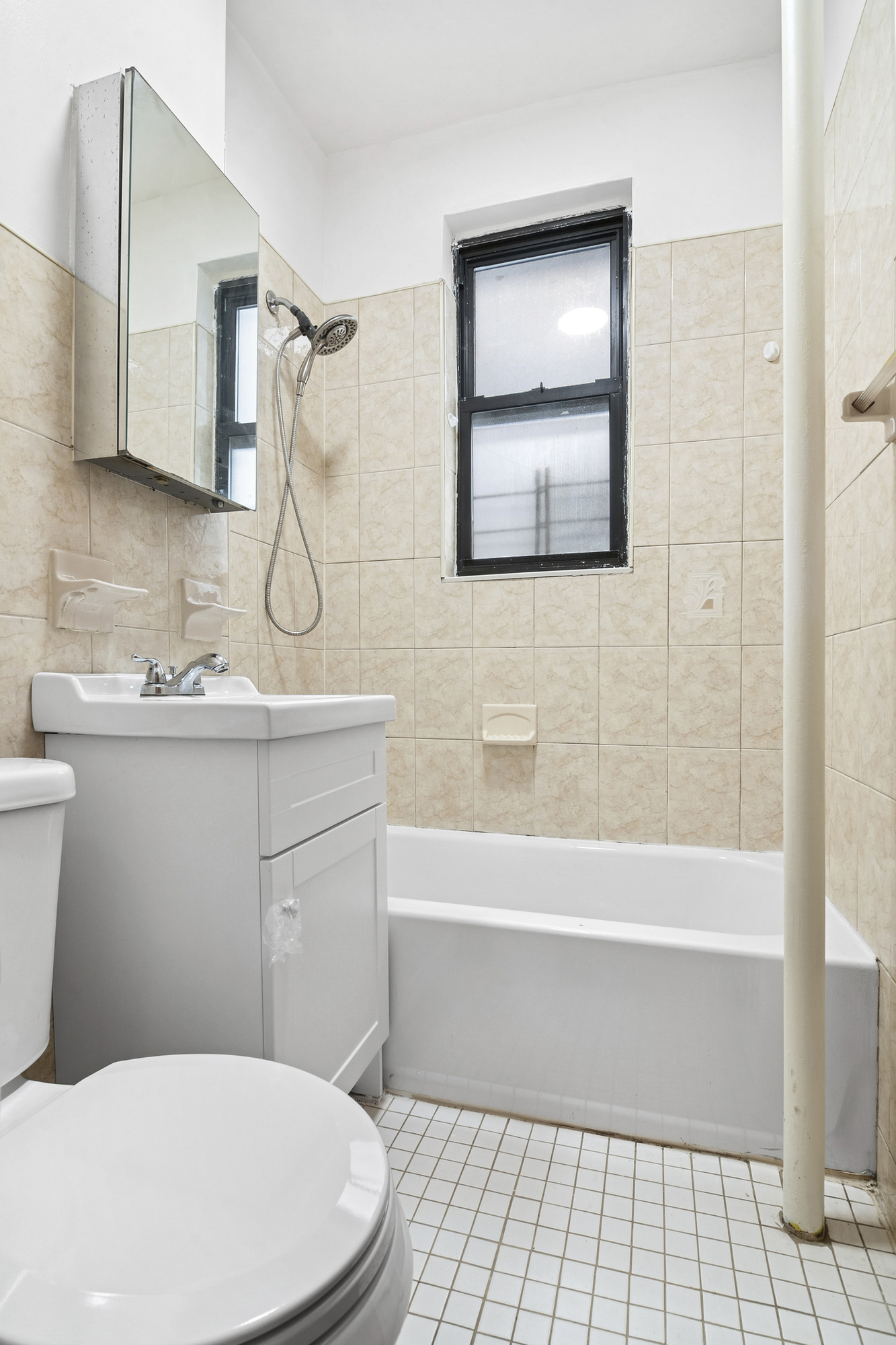 275 Schaefer Street, Unit 2F Brooklyn, NY 11237 - Photo 4 of 4 a bathroom with a sink a toilet and shower