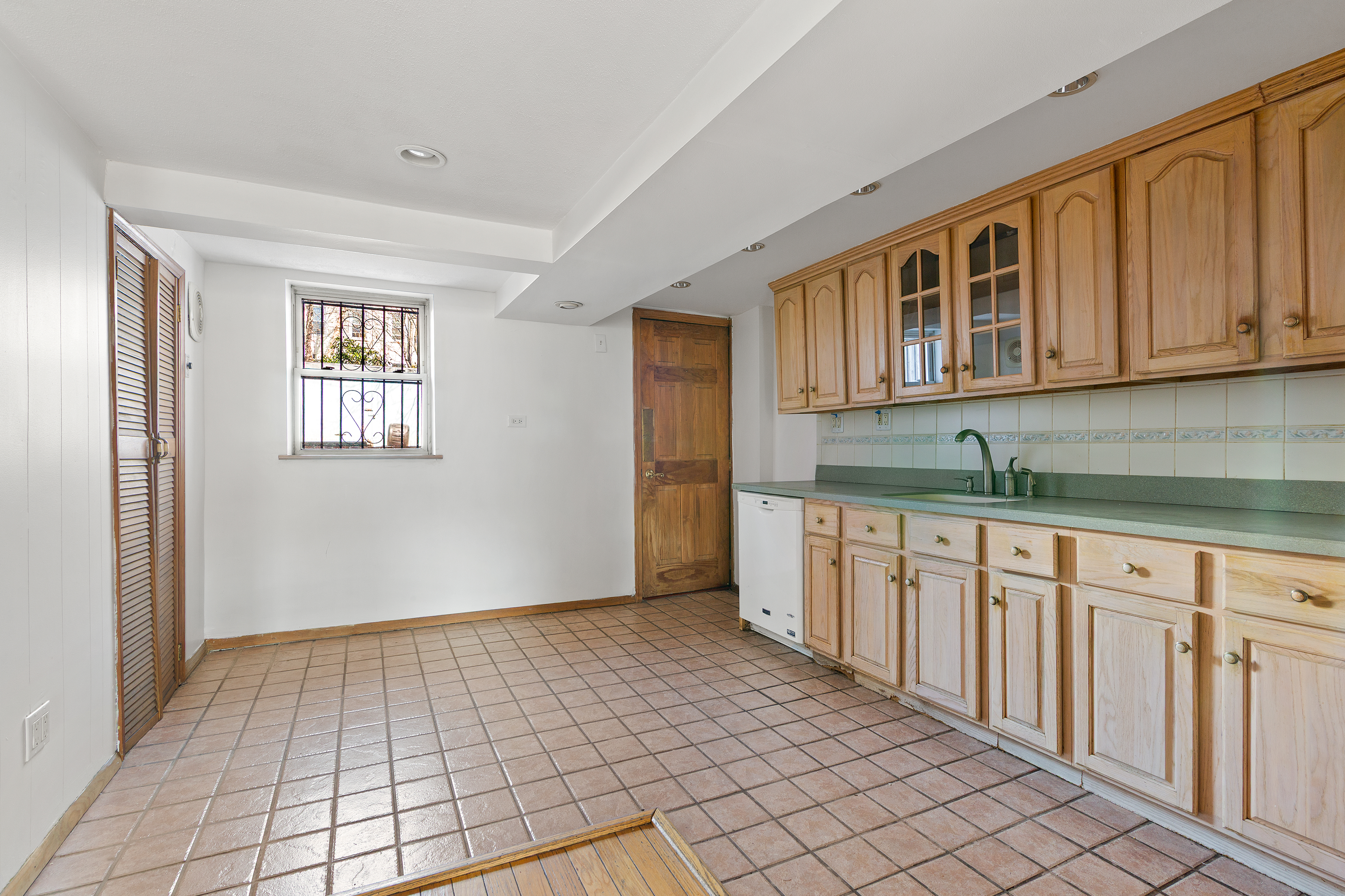 537 18th Street Brooklyn, NY 11215 - Photo 8 of 12 a kitchen with granite countertop a sink