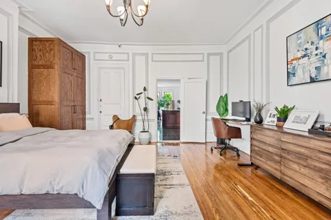 a bed room with a bed and furniture