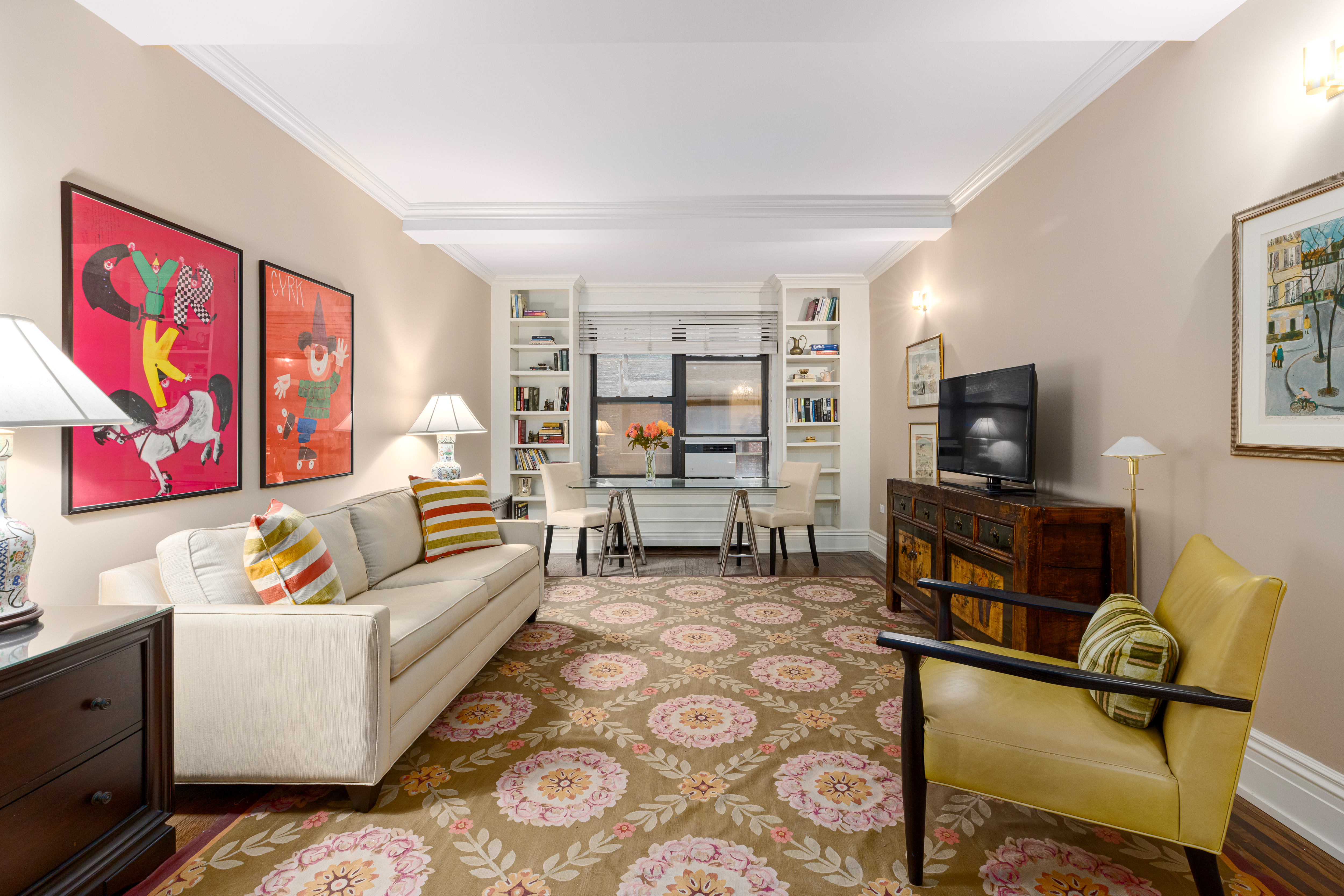 235 West 102nd Street, Unit 3B Manhattan, NY 10025 - Photo 2 of 20 a living room with furniture and a flat screen tv