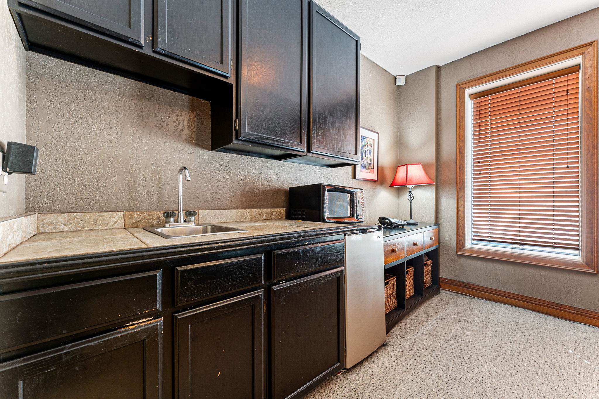 681 Grant Street Denver, CO 80203 - Photo 10 of 15 a kitchen with stainless steel appliances a sink stove and cabinets